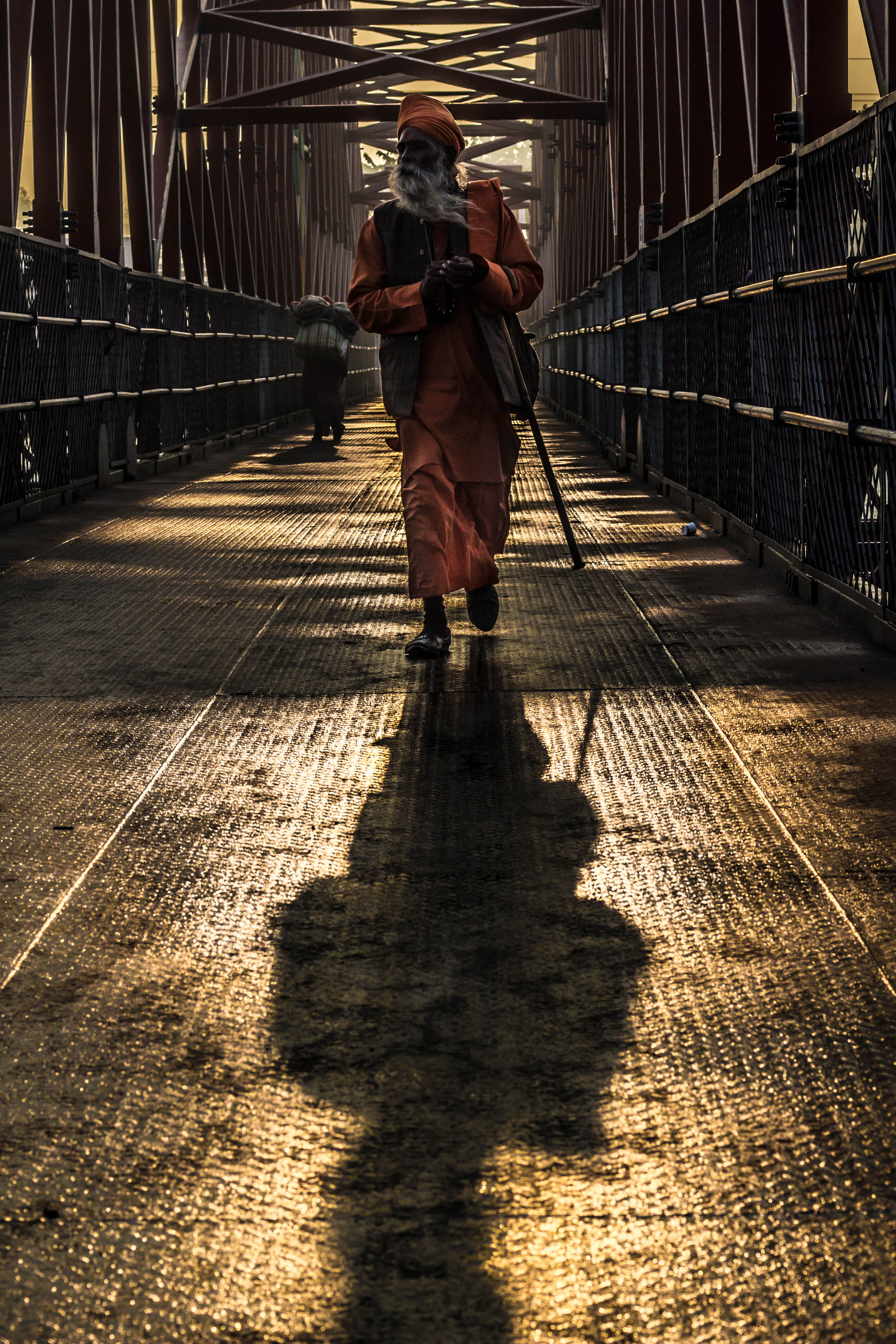 5K, built structure, beard, headdress, cane, one person, railing, line, architecture, orange, person, real people, the way forward, man, walk, women, lifestyles, Phone HD Wallpaper