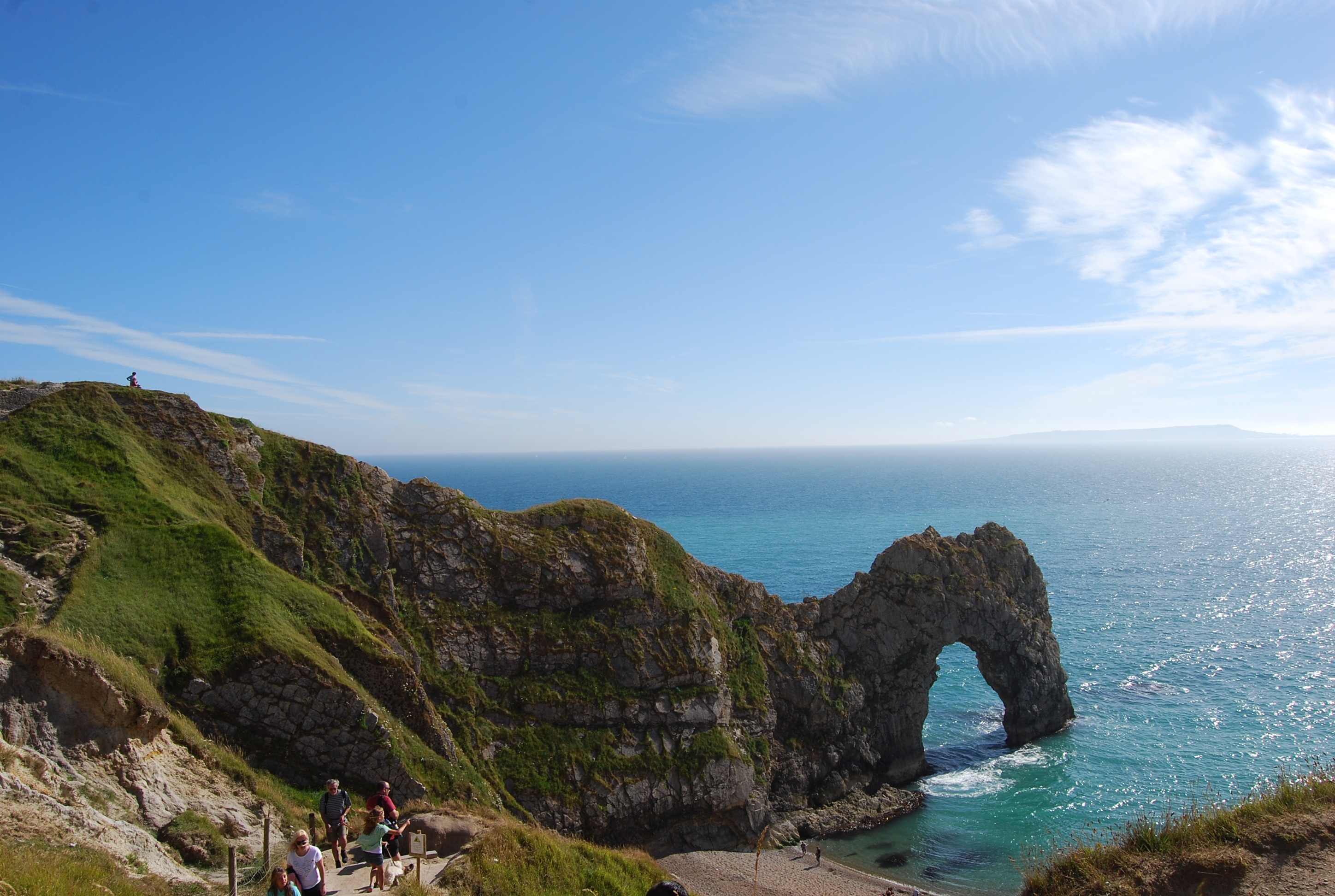 ocean, horizon over water, coastline, horizon, britain, land, sand, rock, cove, outdoors, natural arch, rock formation, real people, sea, tranquility, idyllic, HD Wallpaper