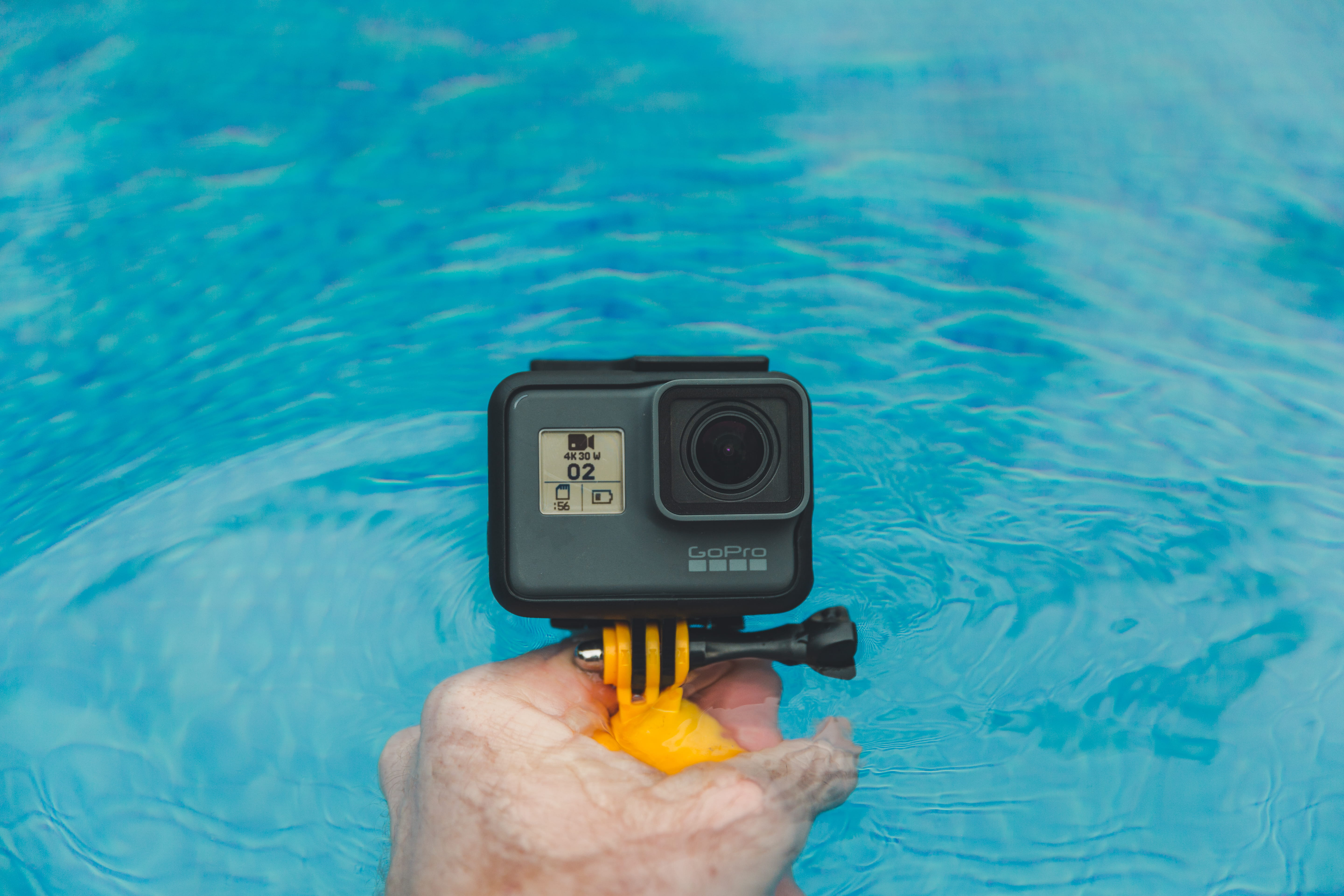 day, nature, action camera, pool, digital camera, water, GoPro, human finger, technology, swimming pool, personal perspective, real people, human limb, HD Wallpaper