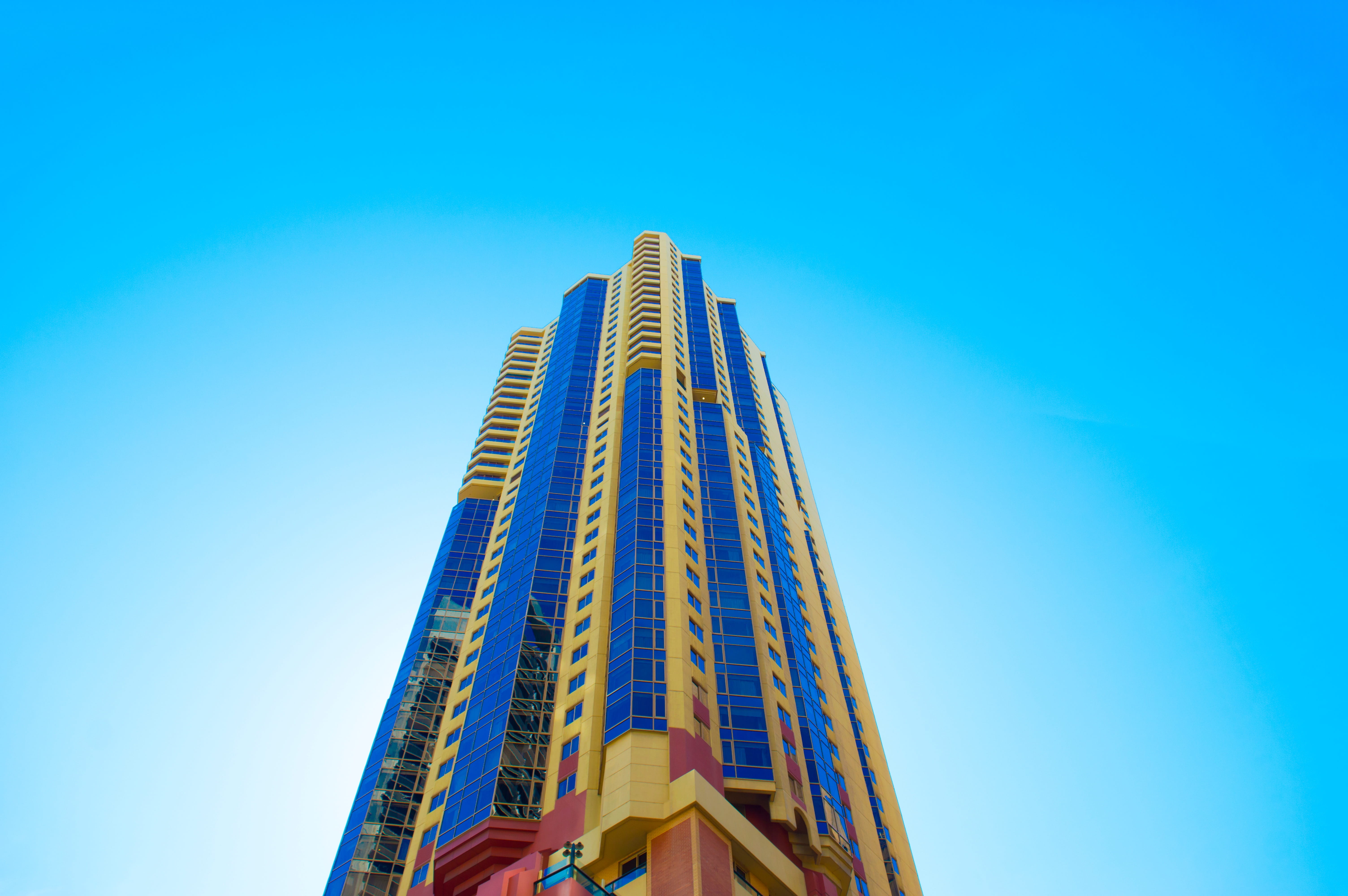 clear sky, built Structure, downtown District, nature, city, low angle view, high, office, skyscraper, famous Place, modern, 5K, rise, brown, no people, HD Wallpaper