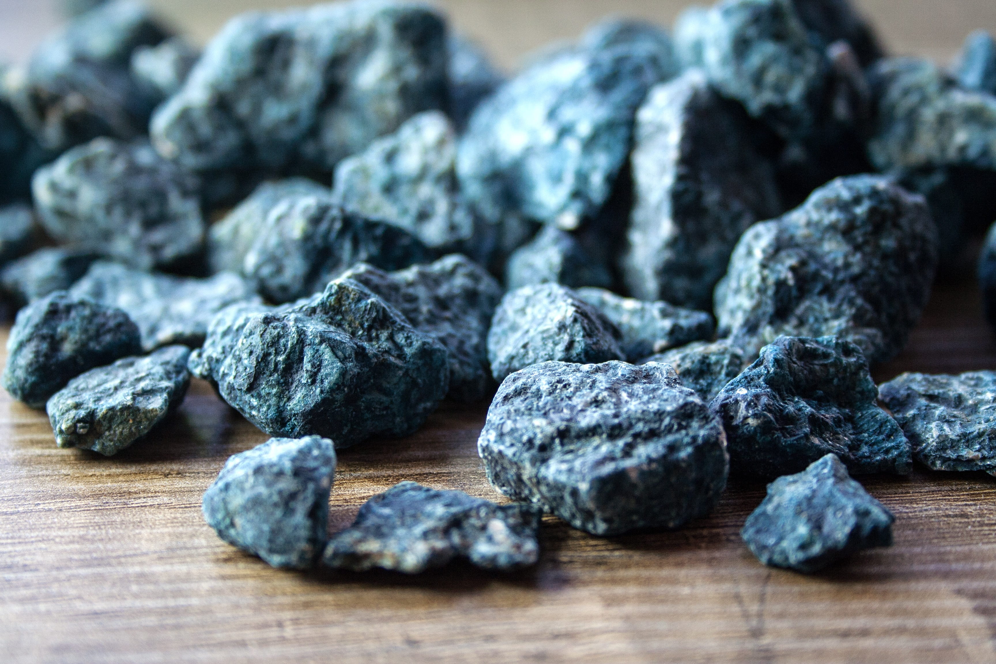 stones, macro, food, coast, wood, mood, still life, selective focus, art, color, table, 2K, healthy eating, black color, wellbeing, food and drink, pile, HD Wallpaper