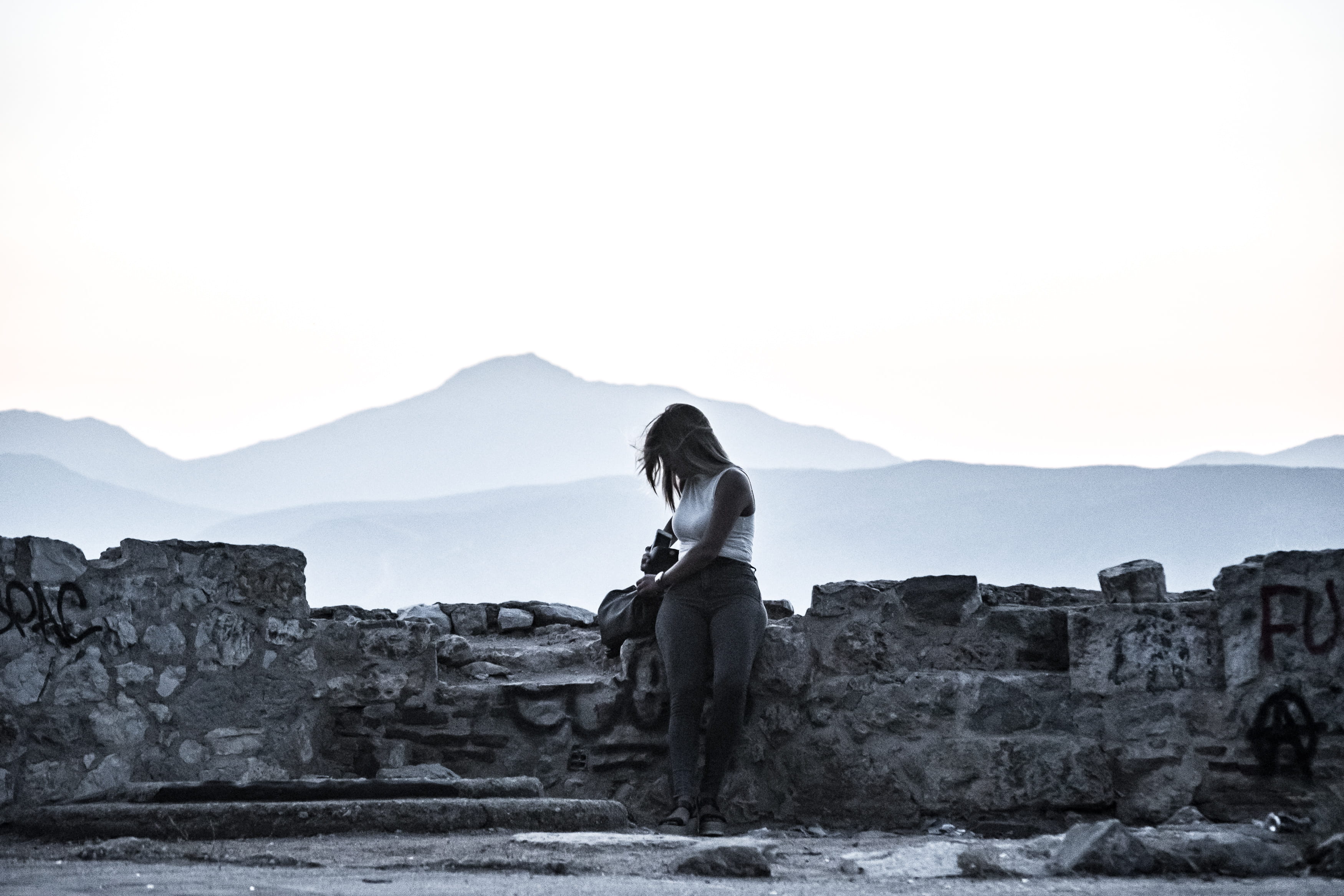 real people, model, one person, beauty, greece, rocks, sunset, day, woman, ancient, travel, mountain range, mountain, abandoned, built structure, casual clothing, HD Wallpaper