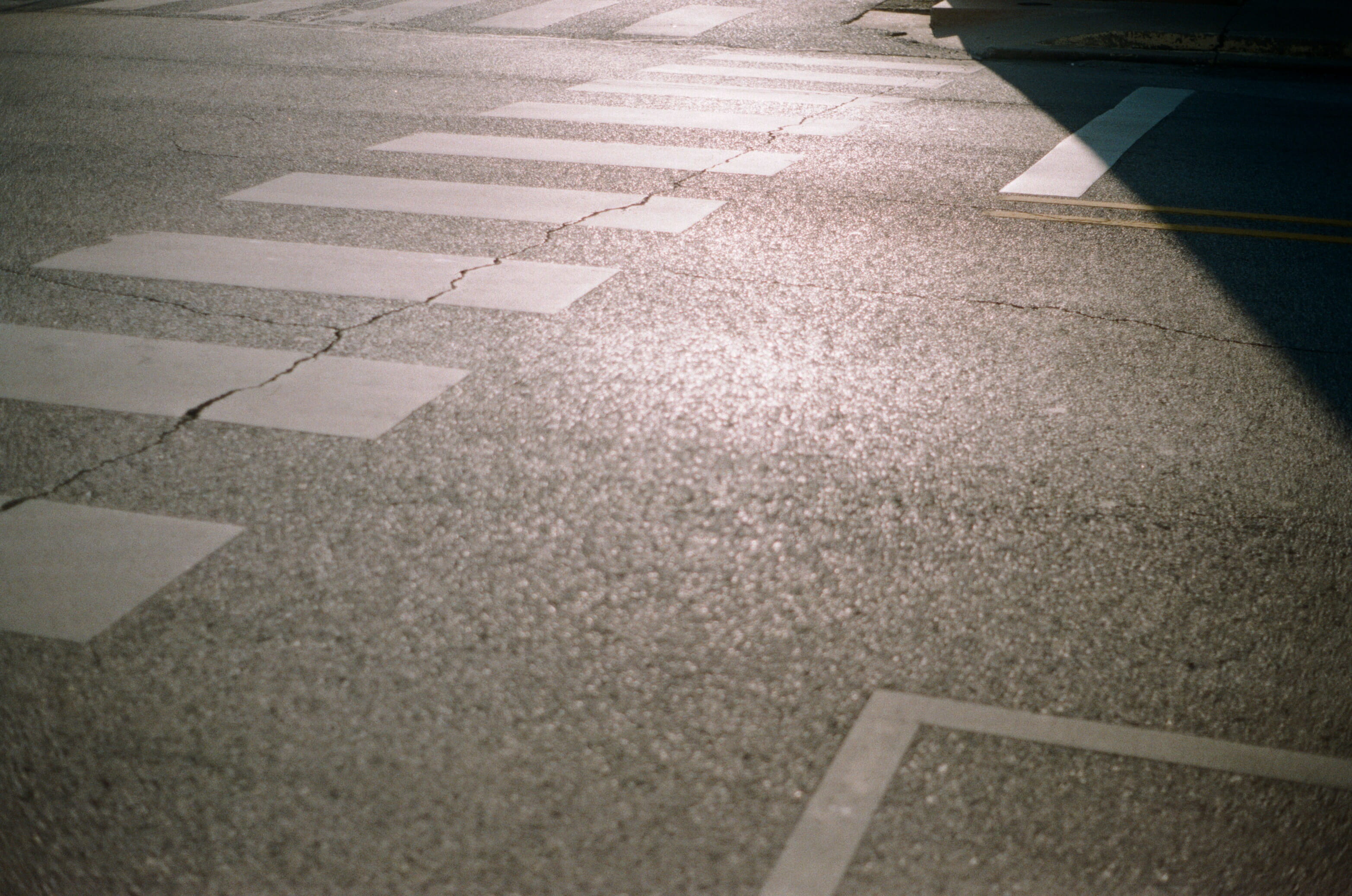 tar, symbol, spoke, outdoors, kneeling, alloy wheel, day, street, rug, light, flooring, surface level, tarmac, road marking, architecture, sign, wood, guidance, HD Wallpaper