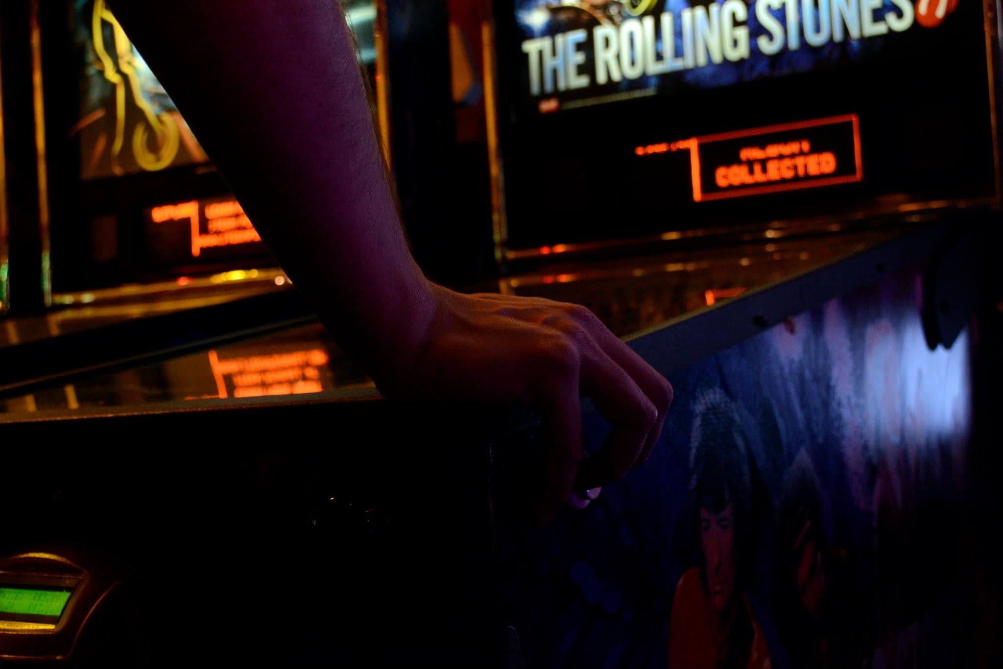 rolling, arcade, adult, holding, stones, body part, nightlife, hand, illuminated, videogame, communication, people, games, human hand, text, machine, indoors, HD Wallpaper