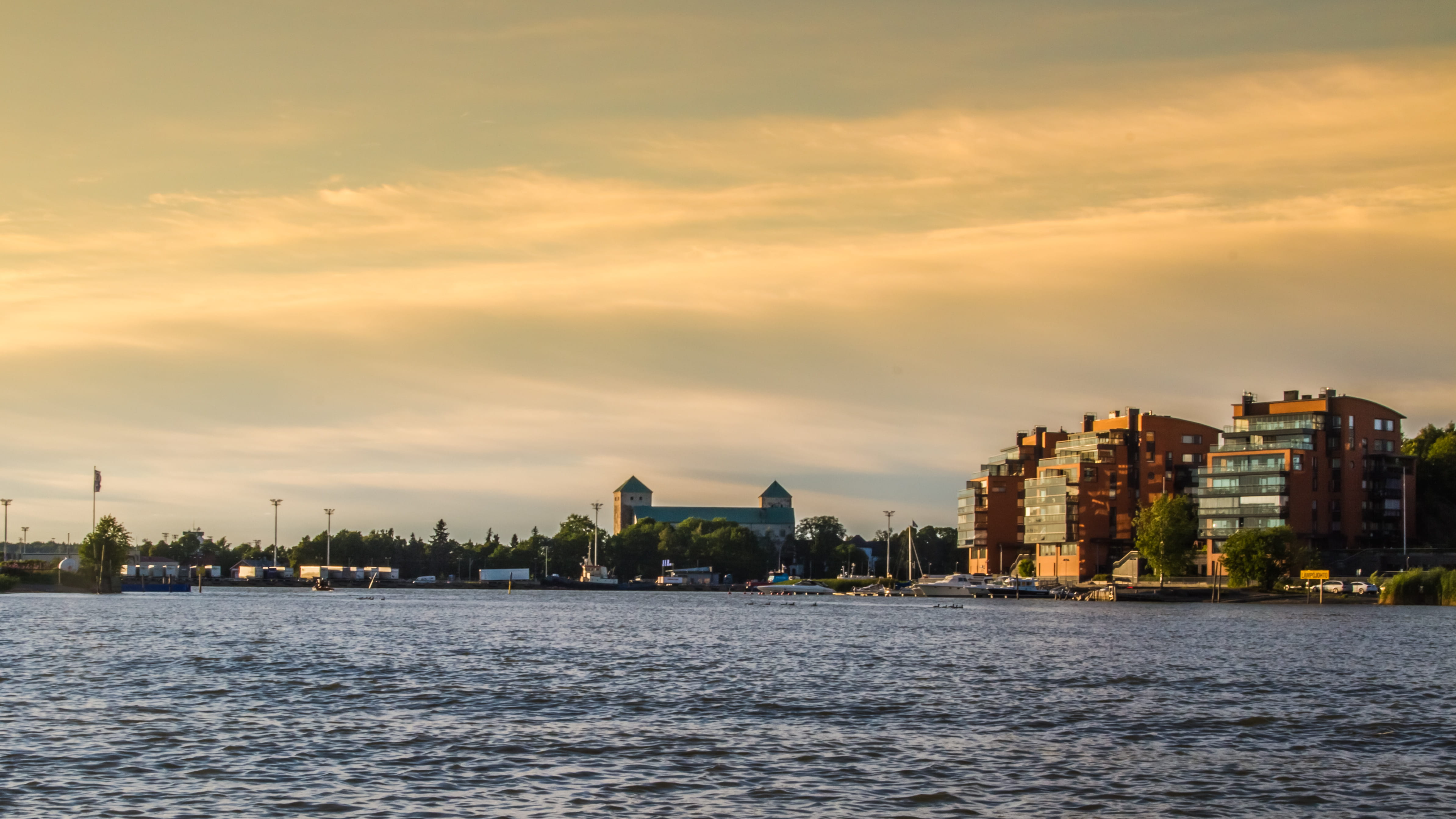 skyscraper, 4K, water, cloud - sky, cityscape, waterfront, city, building, boat, beauty in nature, evening, sunset, urban skyline, harbor, castle, built structure, HD Wallpaper