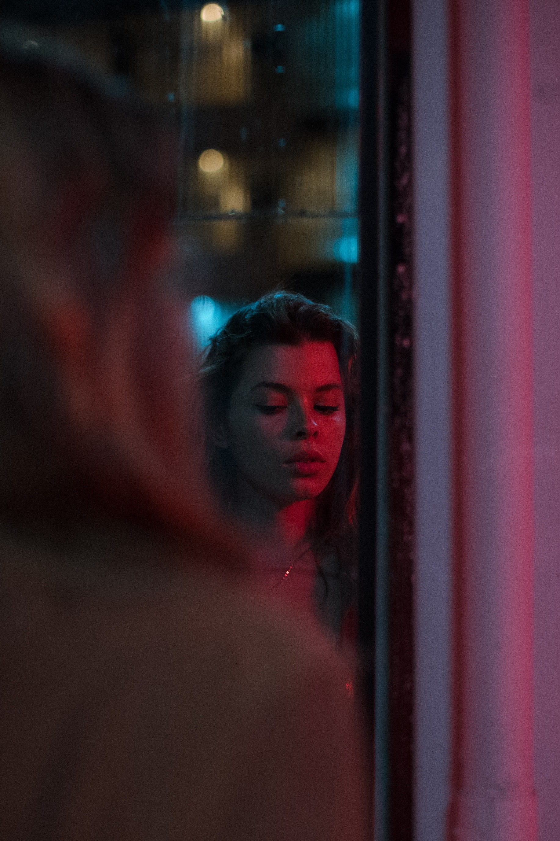 red, young adult, curiosity, hairstyle, indoors, brunette, watching, one person, selective focus, contemplation, reflection, portrait, glass - material, Phone HD Wallpaper