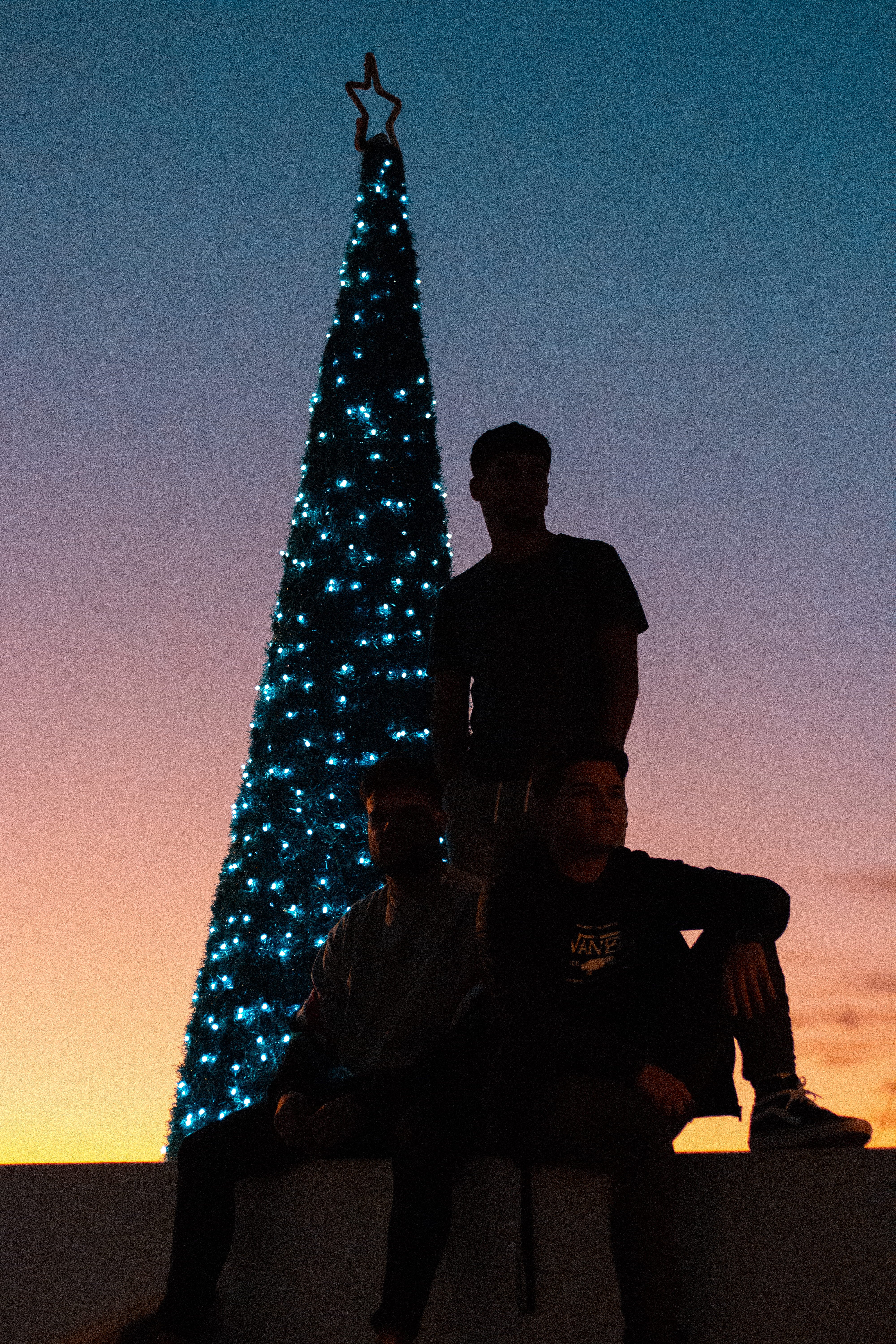 low angle view, spain, arrecife, architecture, lights, silhouette, nature, 5K, shadow, led, real people, men, tree, marina lanzarote, sky, togetherness, Phone HD Wallpaper