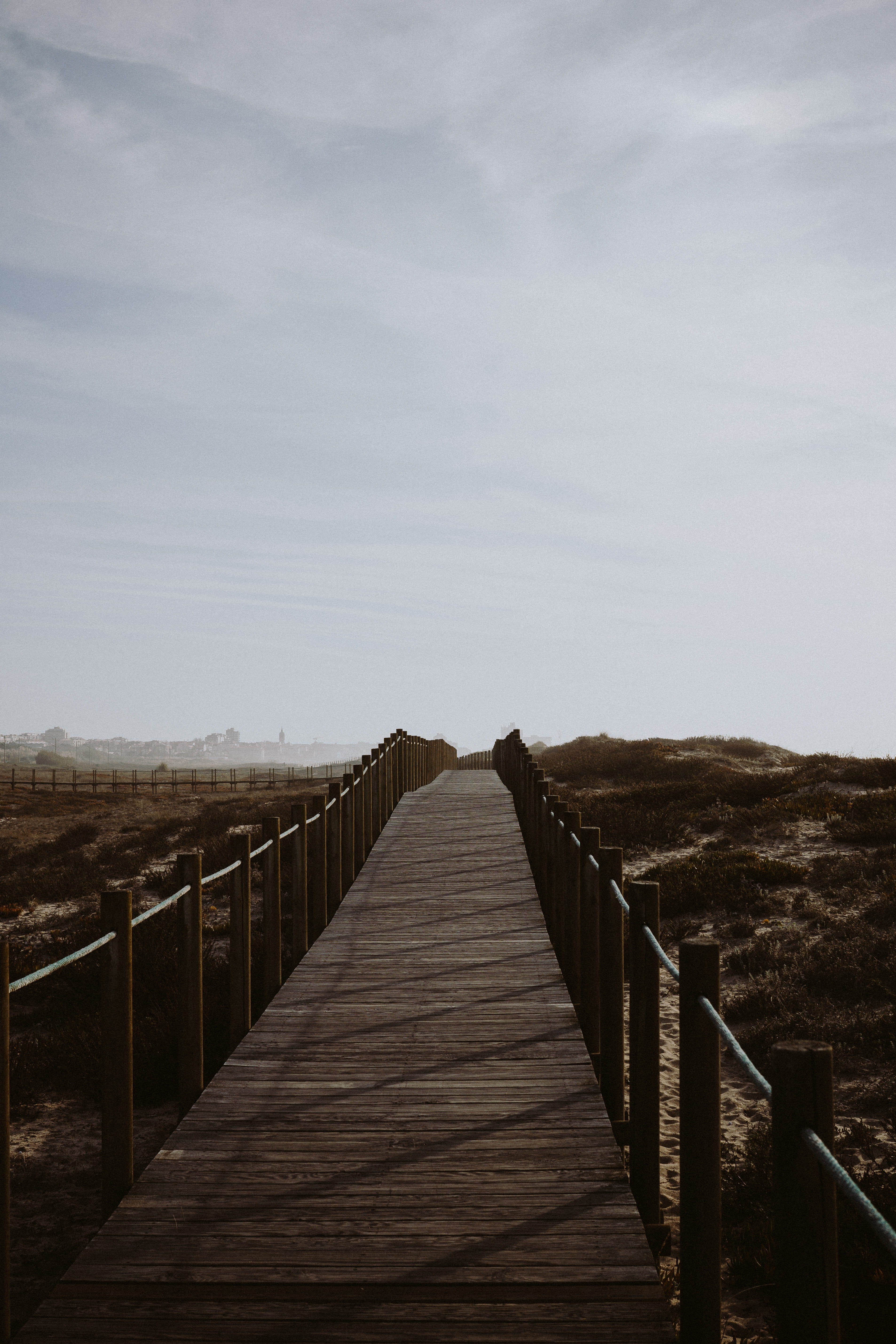 fence, sky, architecture, built structure, tranquility, boardwalk, direction, railing, wooden, barrier, sand, long, day, brown, road, dunes, the way forward, Phone HD Wallpaper