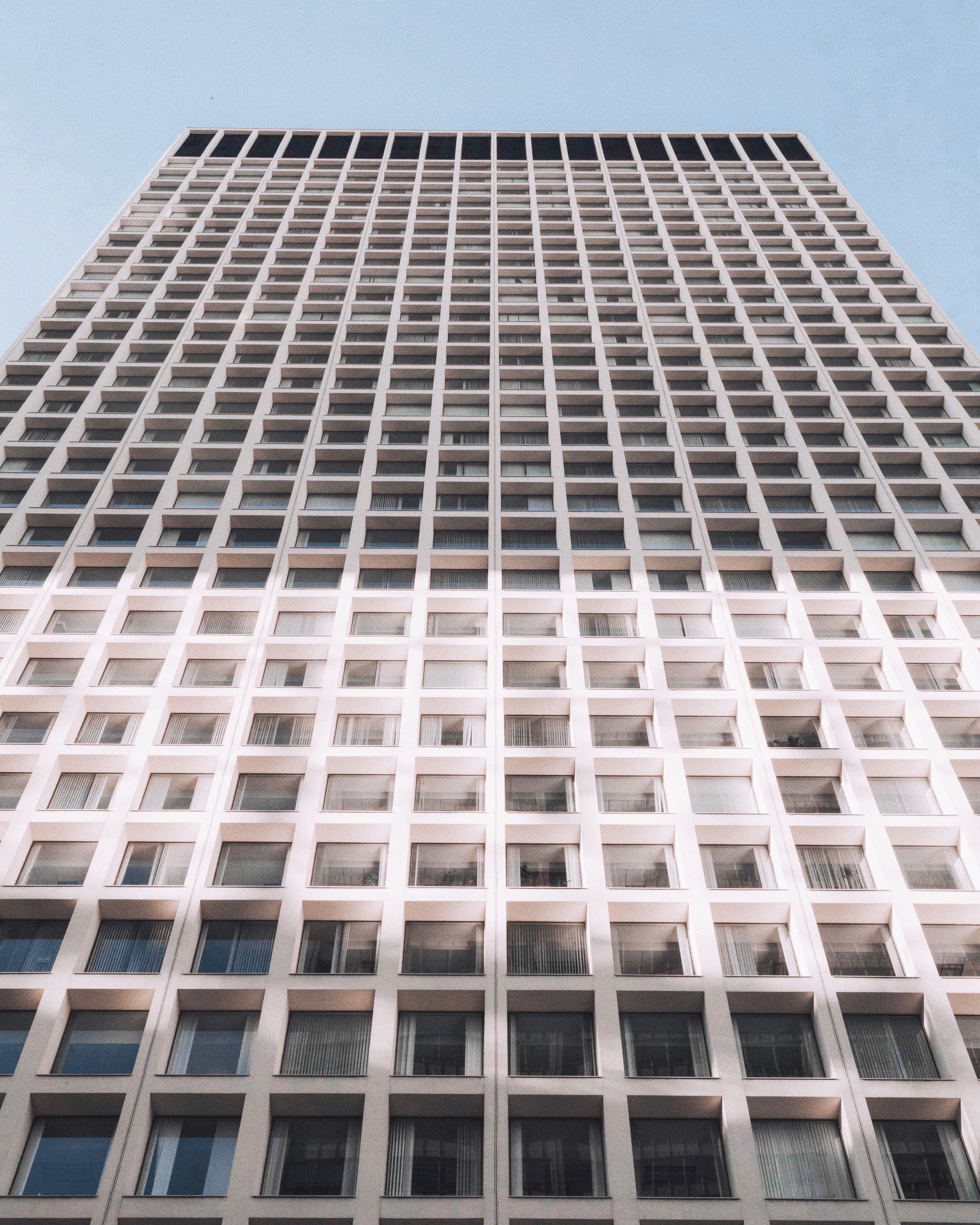 minimal, building exterior, low angle view, city, no people, twilight, highrise, hotel, sky, rise, window, geometric shape, skyscraper, light, looking up, Phone HD Wallpaper