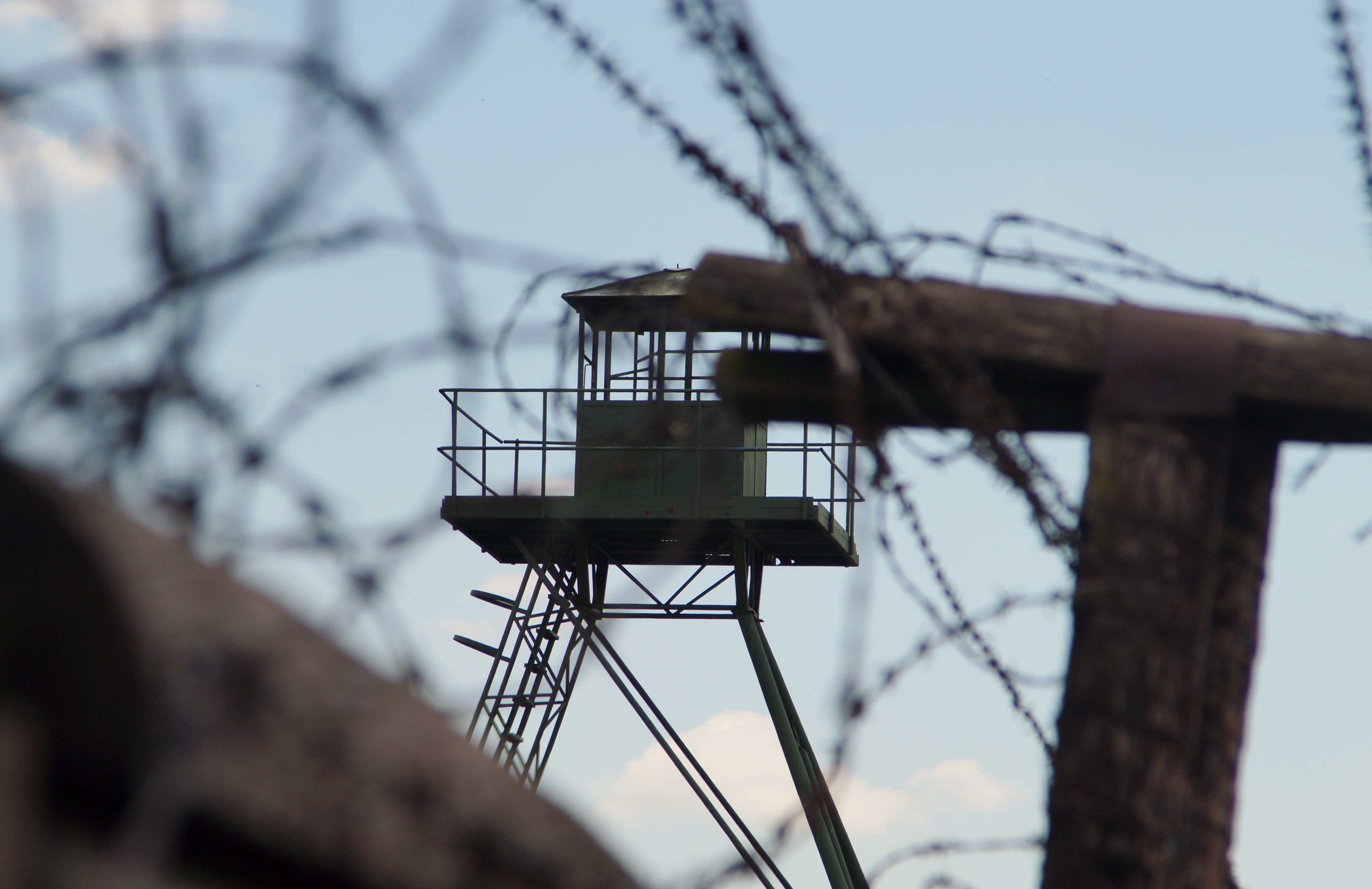 barbed wire, tower, sky, clear sky, safety, built structure, wire, iron curtain, selective focus, no people, protection, bare tree, low angle view, focus on foreground, HD Wallpaper