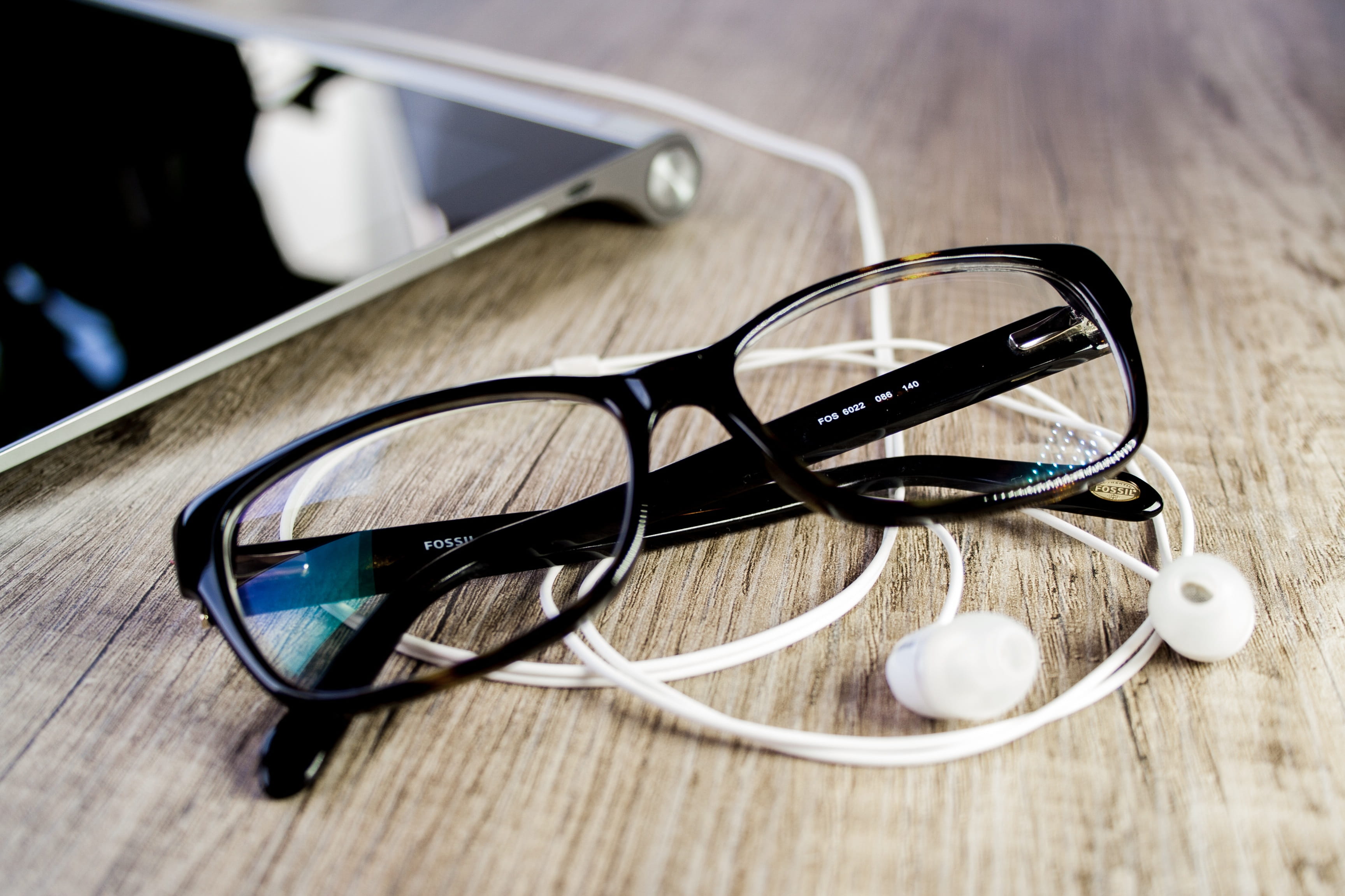 eyesight, wooden table top, cozy, hobby, close, personal accessory, summer, focus on foreground, workplace, eyeglasses, modern, headphones, close-up, reading glasses, HD Wallpaper
