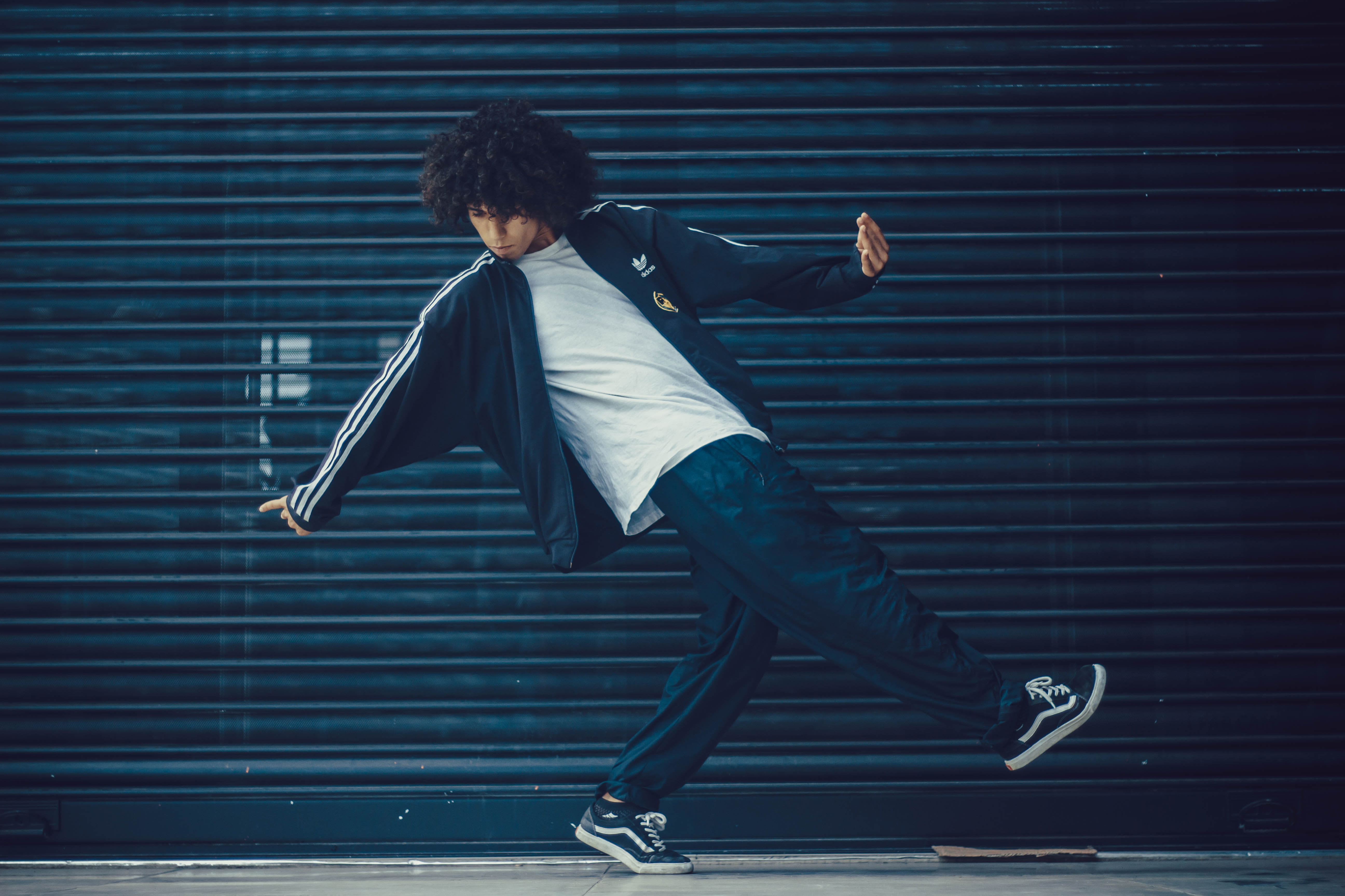 black, mid-air, clothing, posing, tracksuit, vitality, men, door, city, males, standing, casual clothing, metal, jumping, 5K, well-dressed, leisure activity, HD Wallpaper