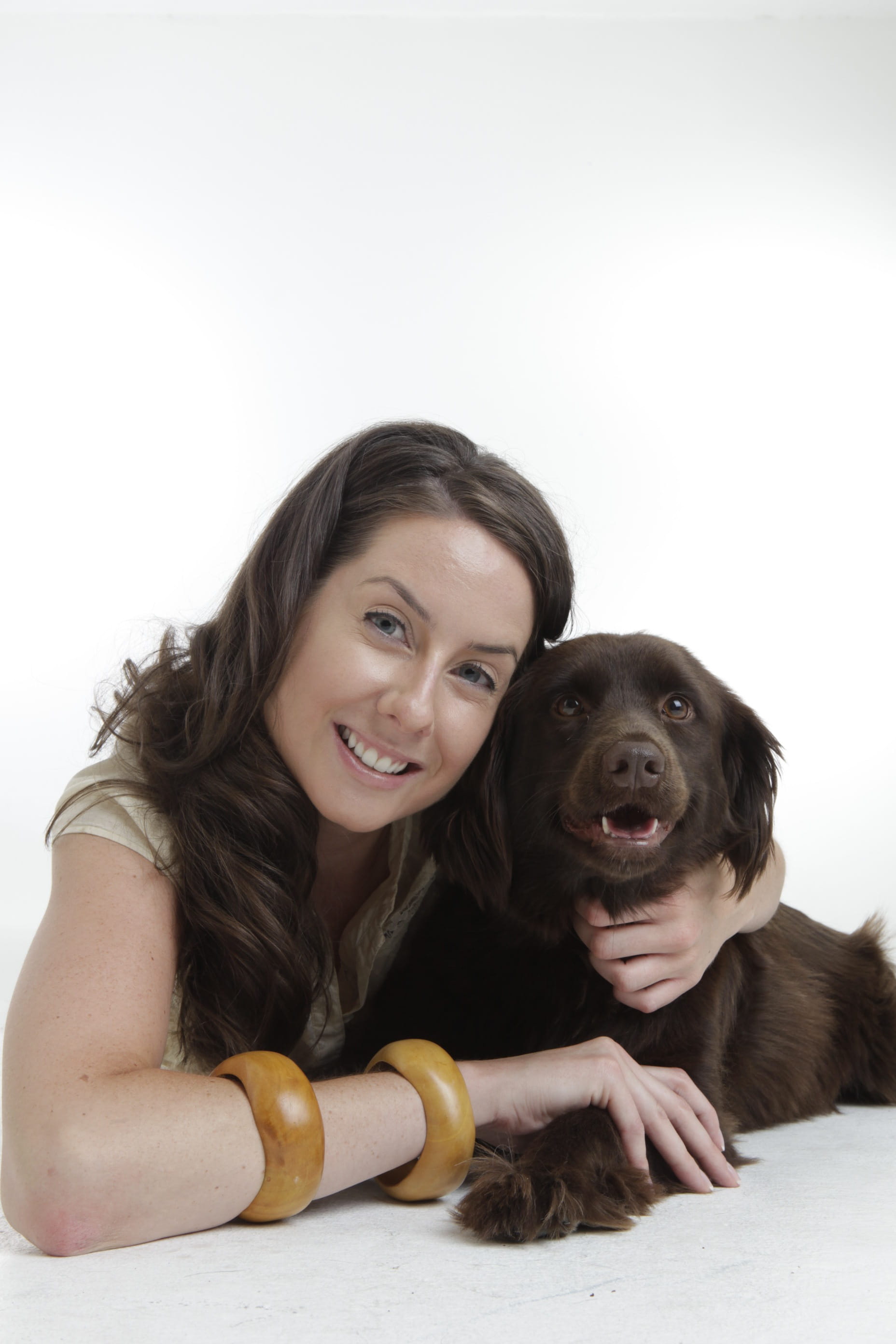 togetherness, white background, looking at camera, pets, canine, indoors, Pet, front view, Girl, women, lying, happiness, brown, friends, emotion, portrait, Phone HD Wallpaper
