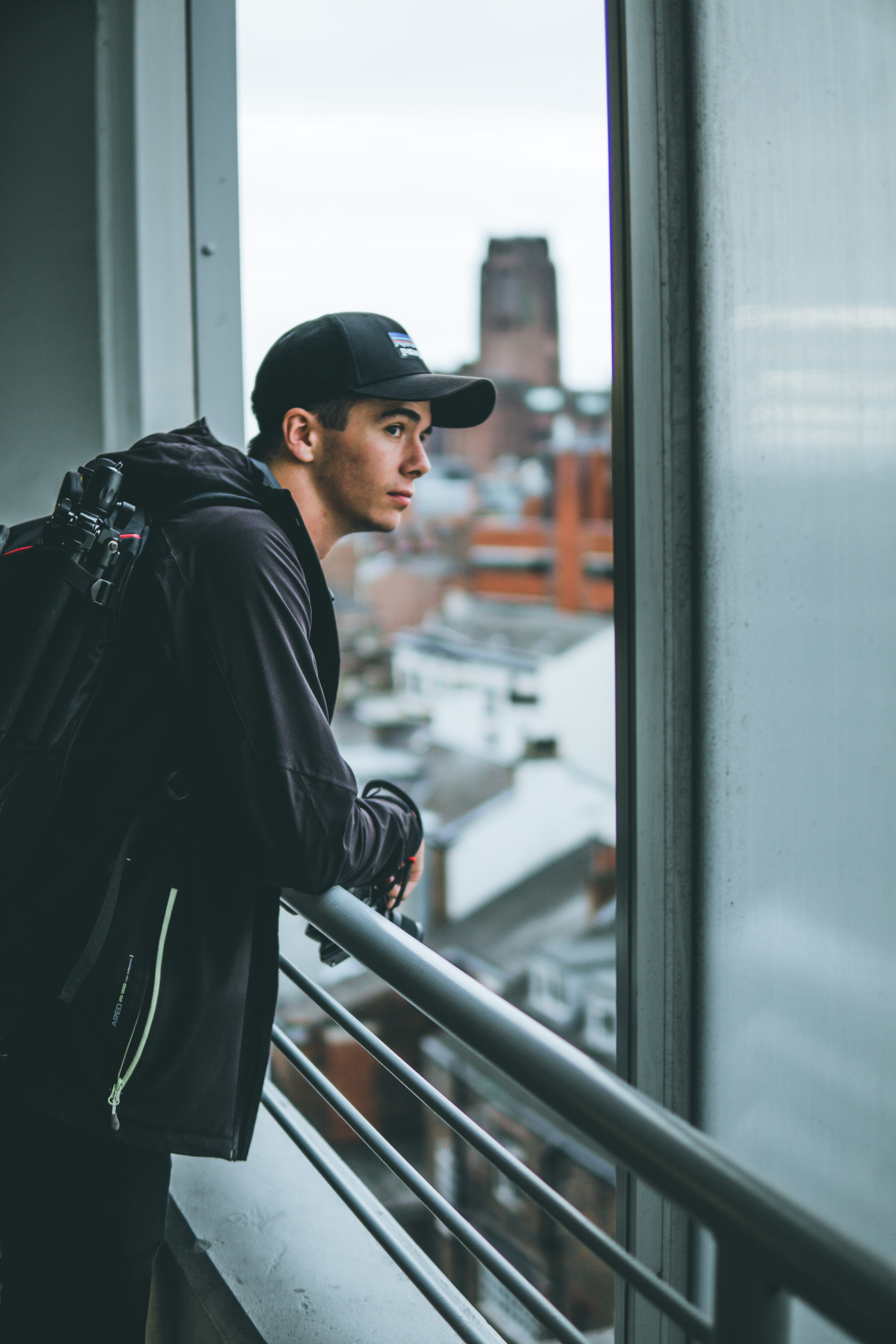 lifestyles, leisure activity, clothing, casual clothing, railing, 5K, one person, side view, britain, young men, indoors, window, hat, day, town, three quarter length, Phone HD Wallpaper