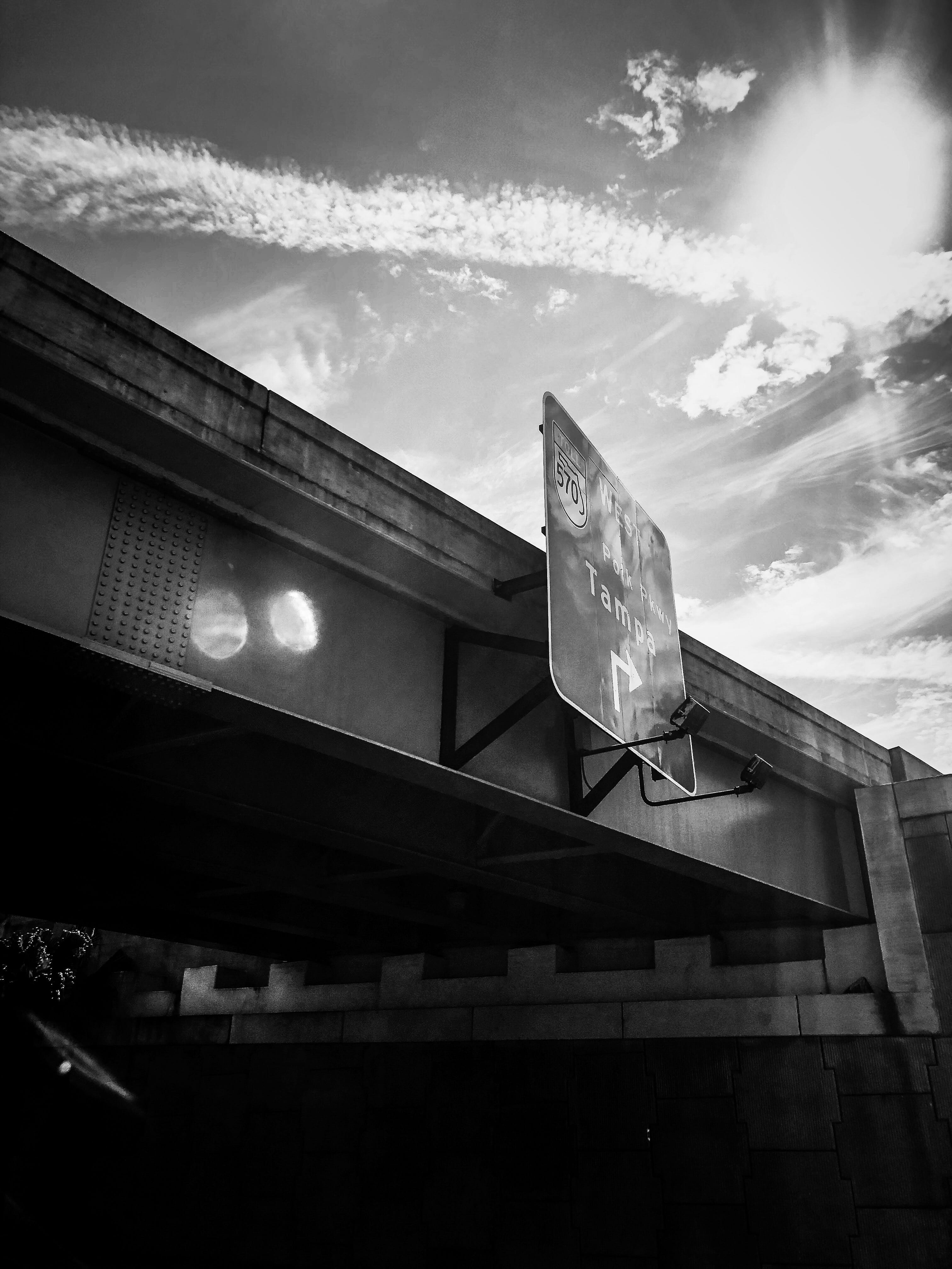 road sign, illuminated, 3870 fl-37, information, low angle view, building, sunlight, day, text, built structure, 4K, sun, sign, cloud - sky, outdoors, Phone HD Wallpaper