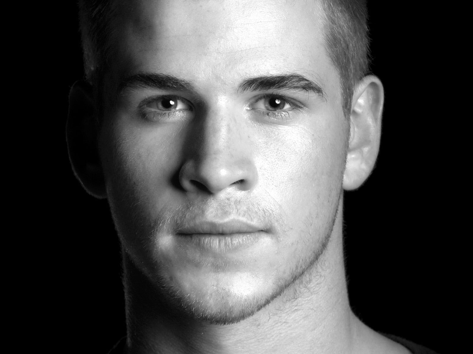 close-up, human face, one person, Eyes, black background, human body part, indoors, looking at camera, serious, Liam hemsworth, men, front view, headshot, HD Wallpaper