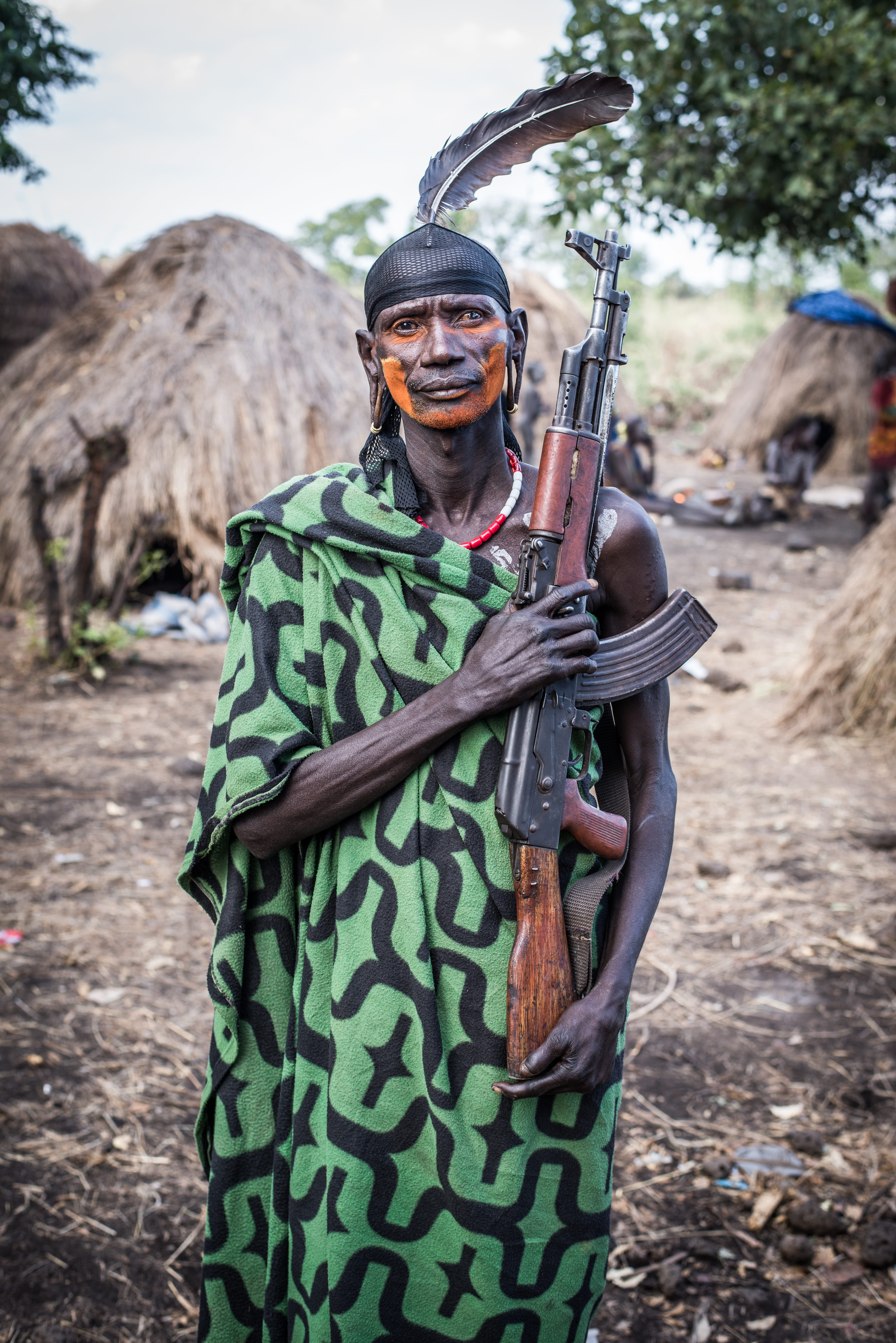 fashion, warrior, aiming, war, power, omo valley, aggression, traditional, murci, village, ak, travel, men, outdoors, danger, tribal, one Person, green, Phone HD Wallpaper