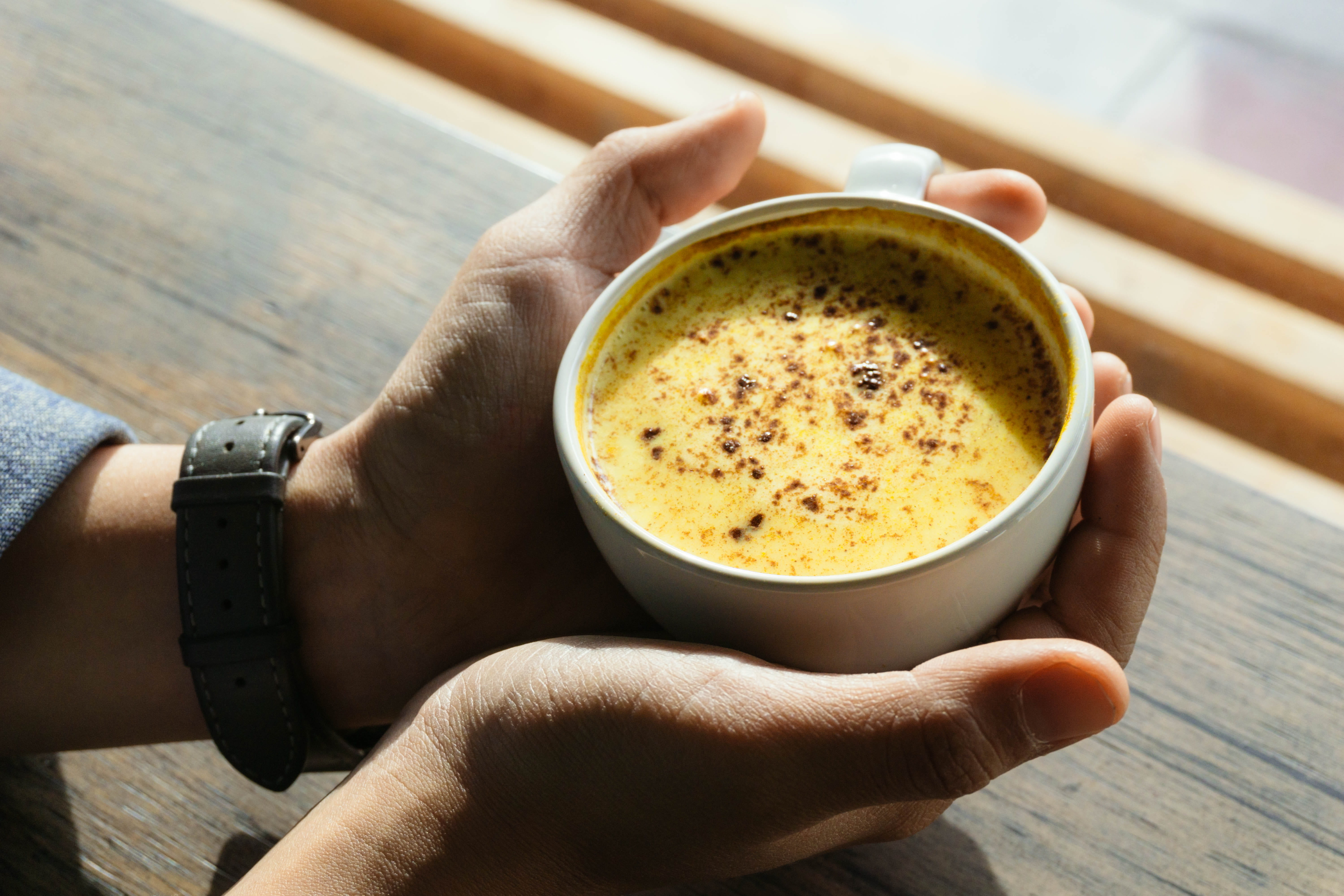 tumeric latte, tijuana, freshness, cup, personal perspective, body part, finger, focus on foreground, golden drink, 5K, golden latte, drink, day, one person, HD Wallpaper