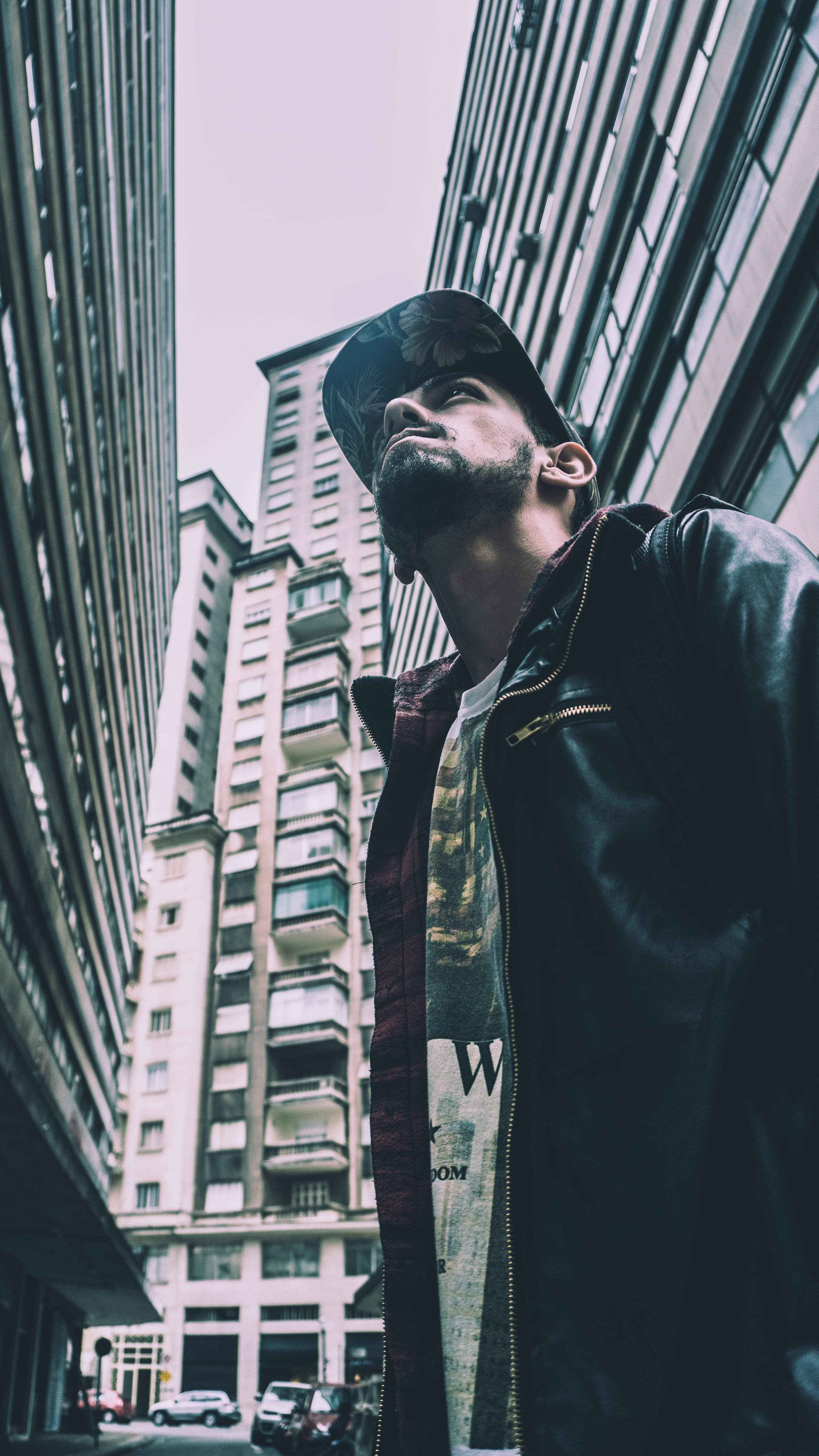 building exterior, black, day, looking, built structure, front view, urban, man, young adult, low angle view, metro, office building exterior, subway, contemplation, Phone HD Wallpaper
