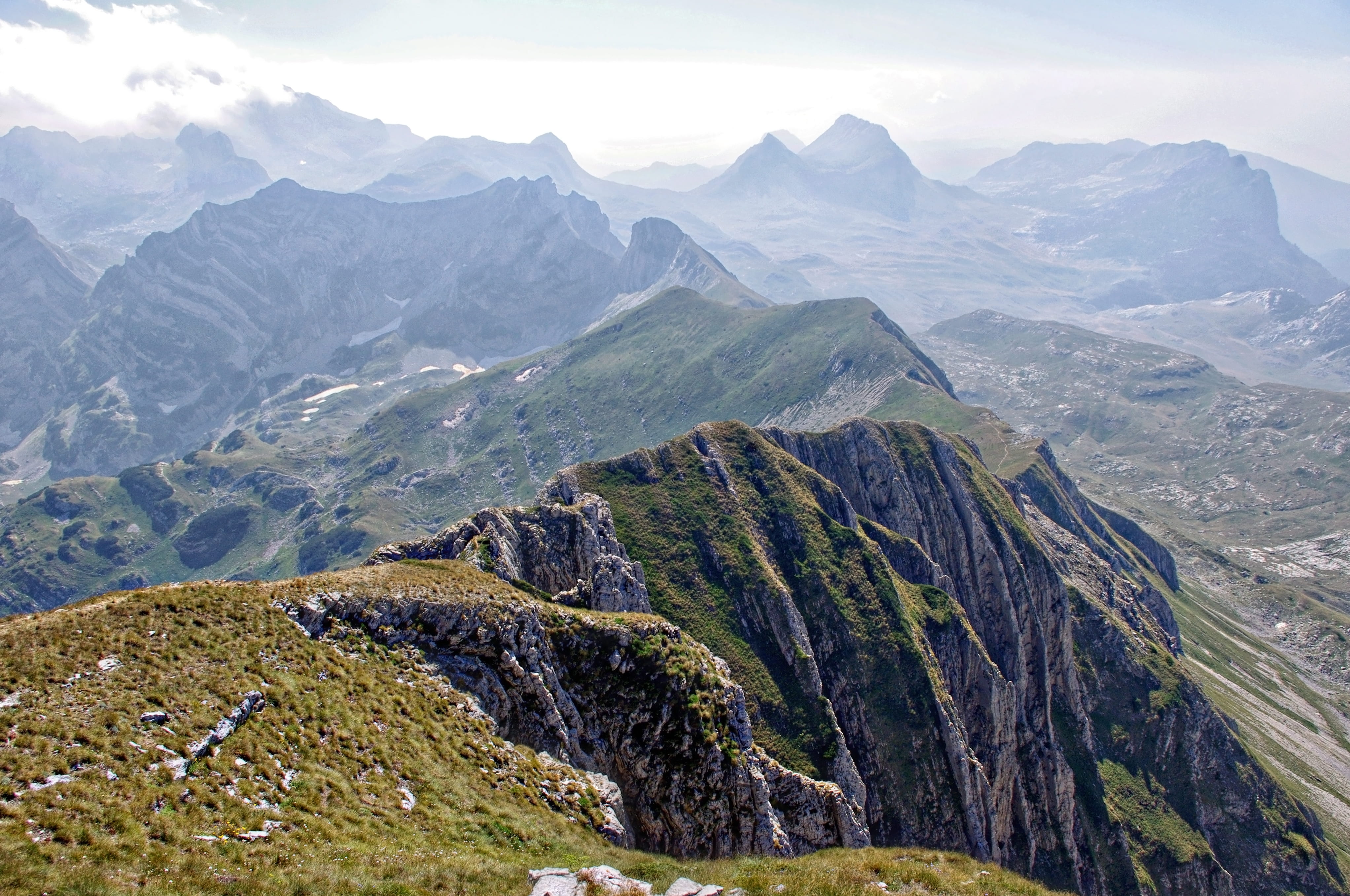 no people, hill, outdoors, highland, rocky, tranquility, nature, mountain peak, grass, mountain range, distance fog, ranges, blue, day, peak, photo, rock, HD Wallpaper