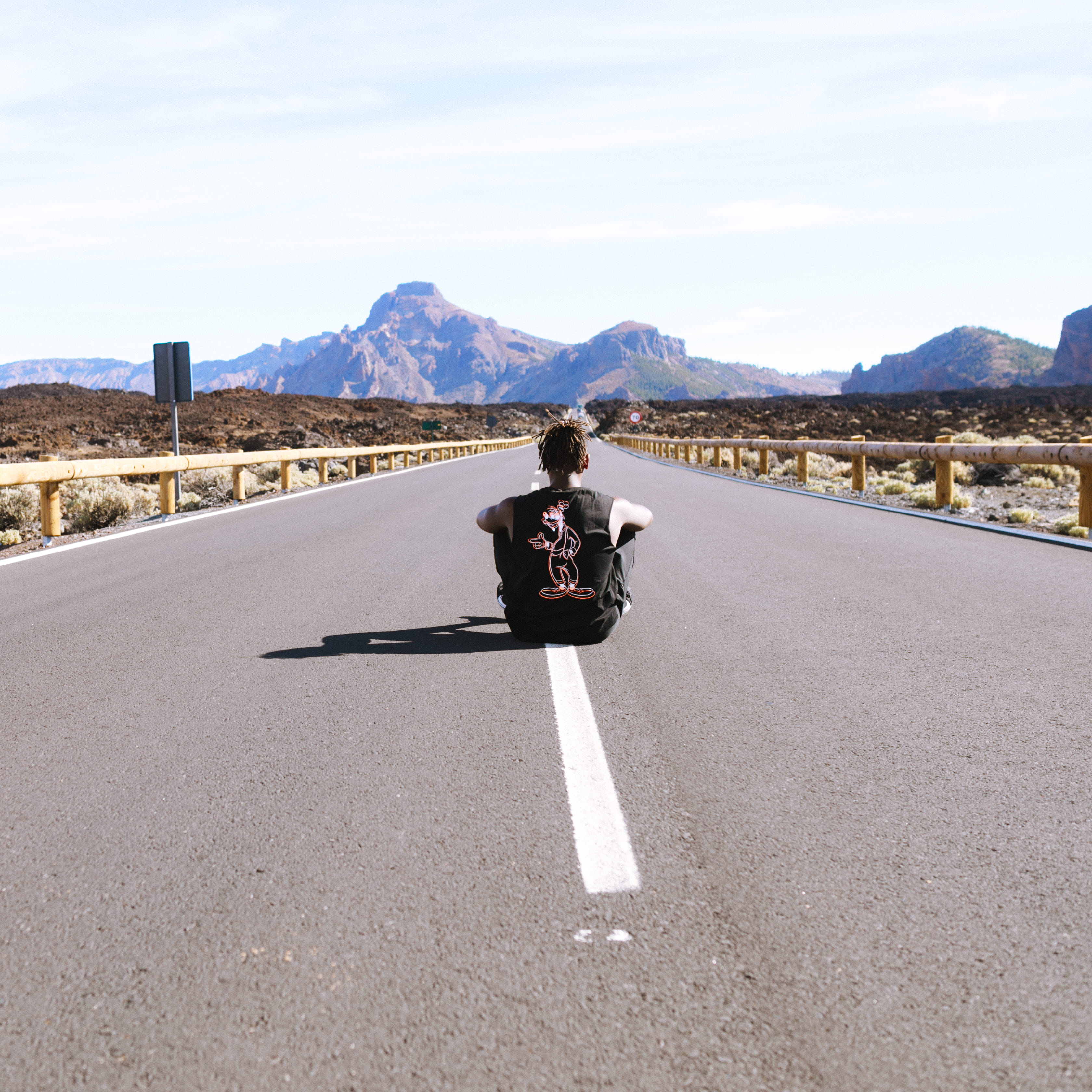 male, human, road, one person, wild, tarmac, mountain, mount teidi, sunlight, apparel, sky, man sitting, rear view, leisure activity, way, road marking, Phone HD Wallpaper