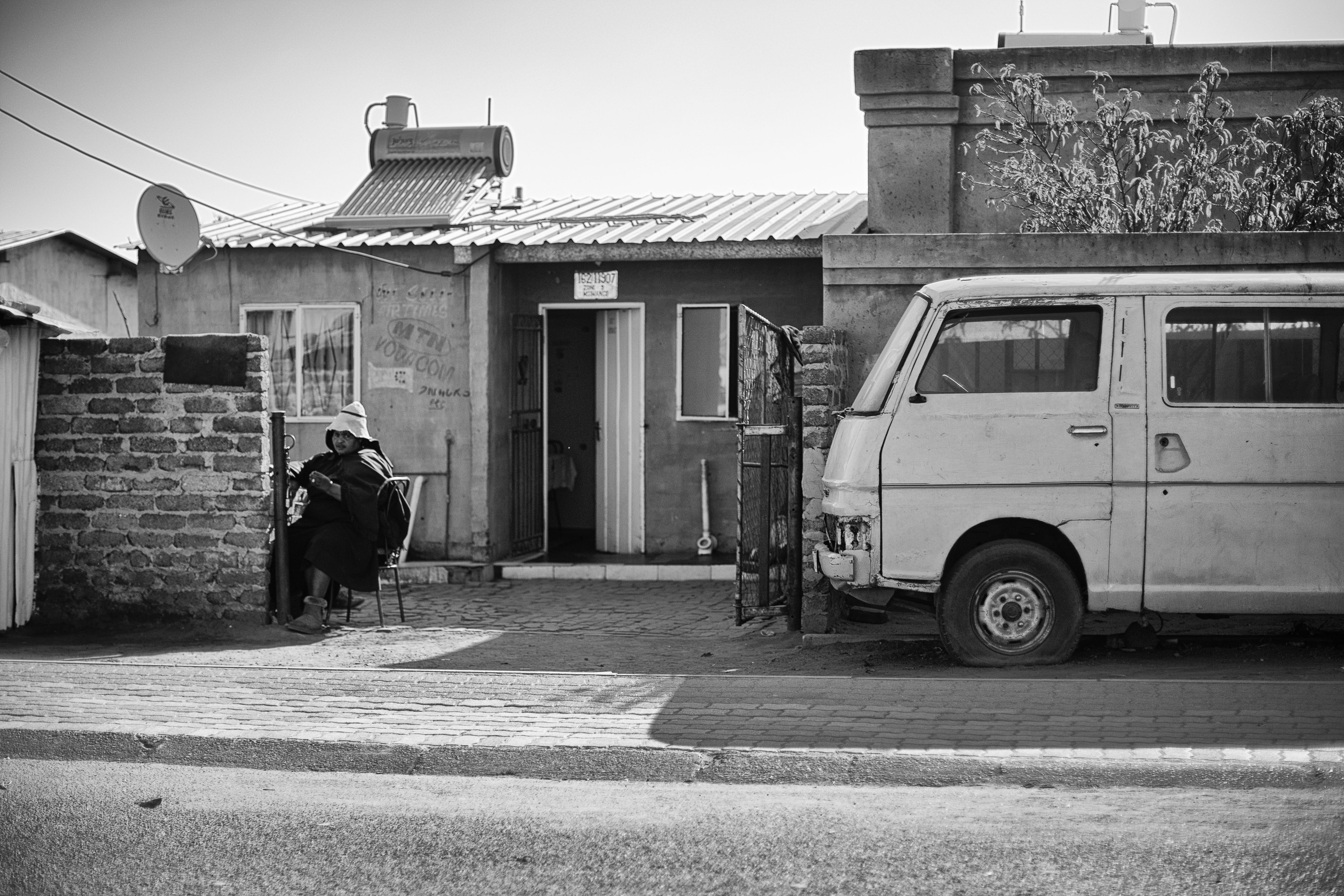 streetphotography, lifestyles, building exterior, one person, house, southafrica, outdoors, soweto, blackandwhite, grayscale, door, day, architecture, black and white, HD Wallpaper