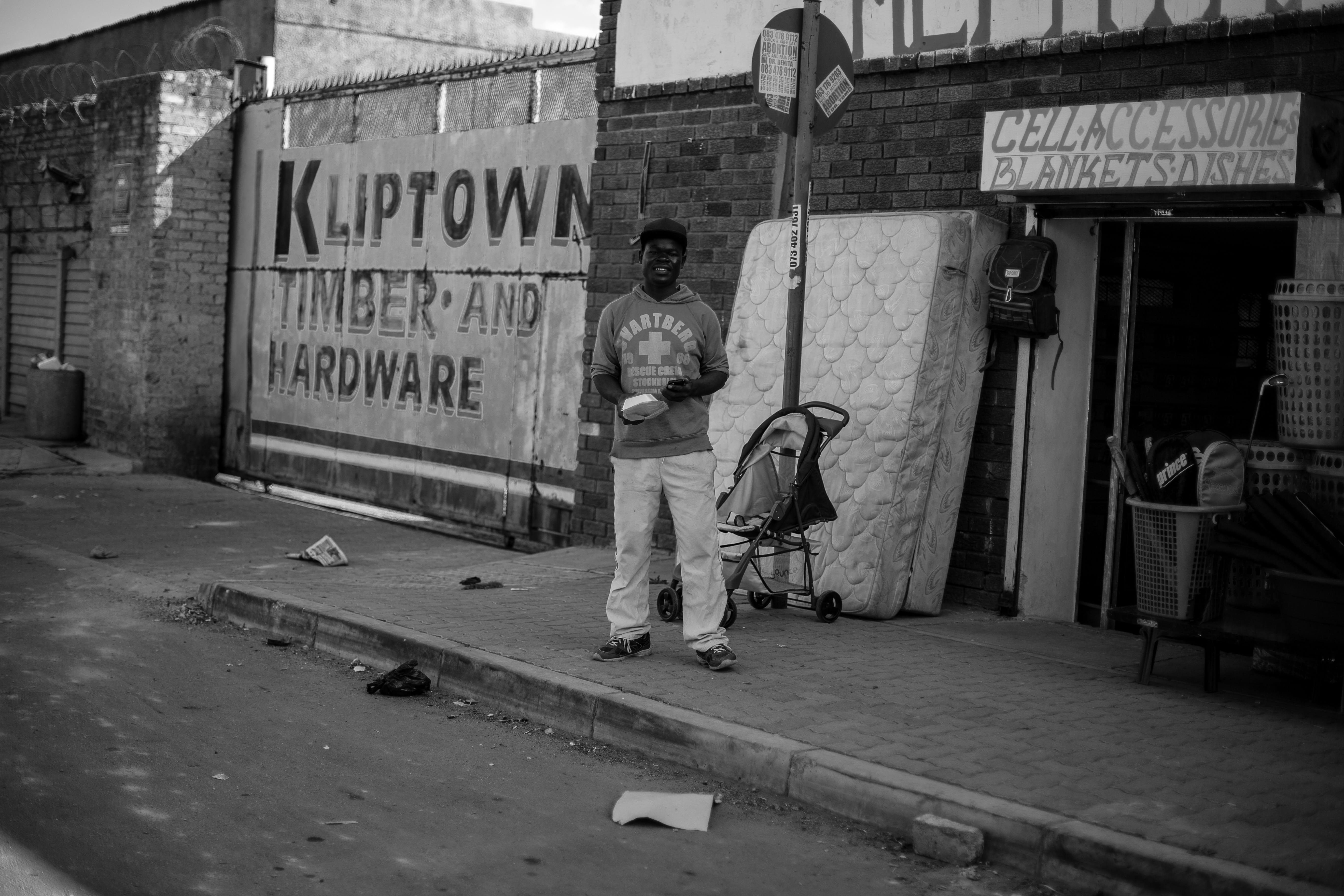 johannesburg, city, communication, 5K, real people, day, built structure, full length, footpath, outdoors, text, casual clothing, south africa, human representation, HD Wallpaper