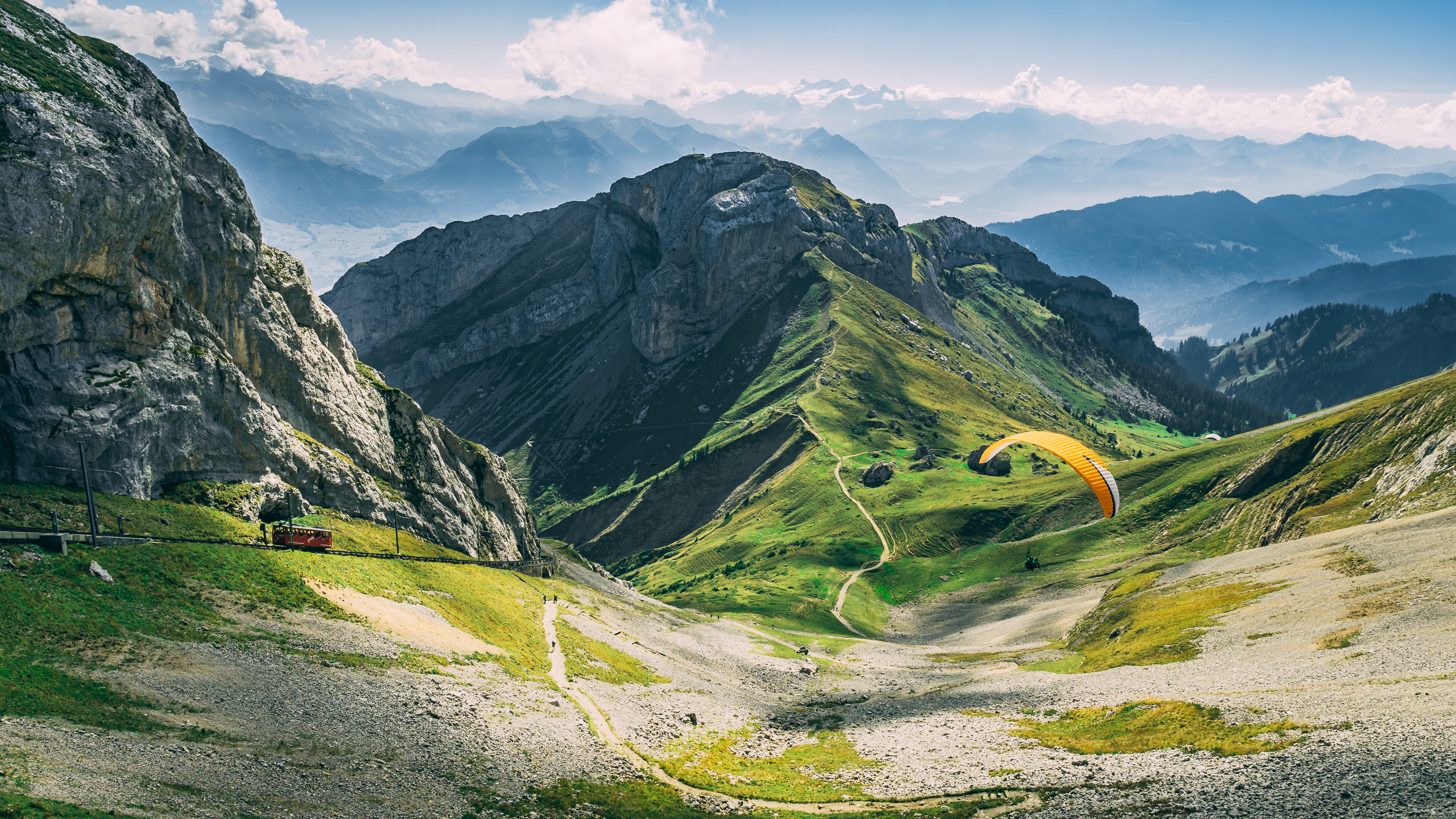 high, clouds, cloud - sky, grass, trees, road, mountain peak, remote, cloudy, scenery, mountain, blue sky, rocks, paragliding, brown, green color, mountain range, HD Wallpaper