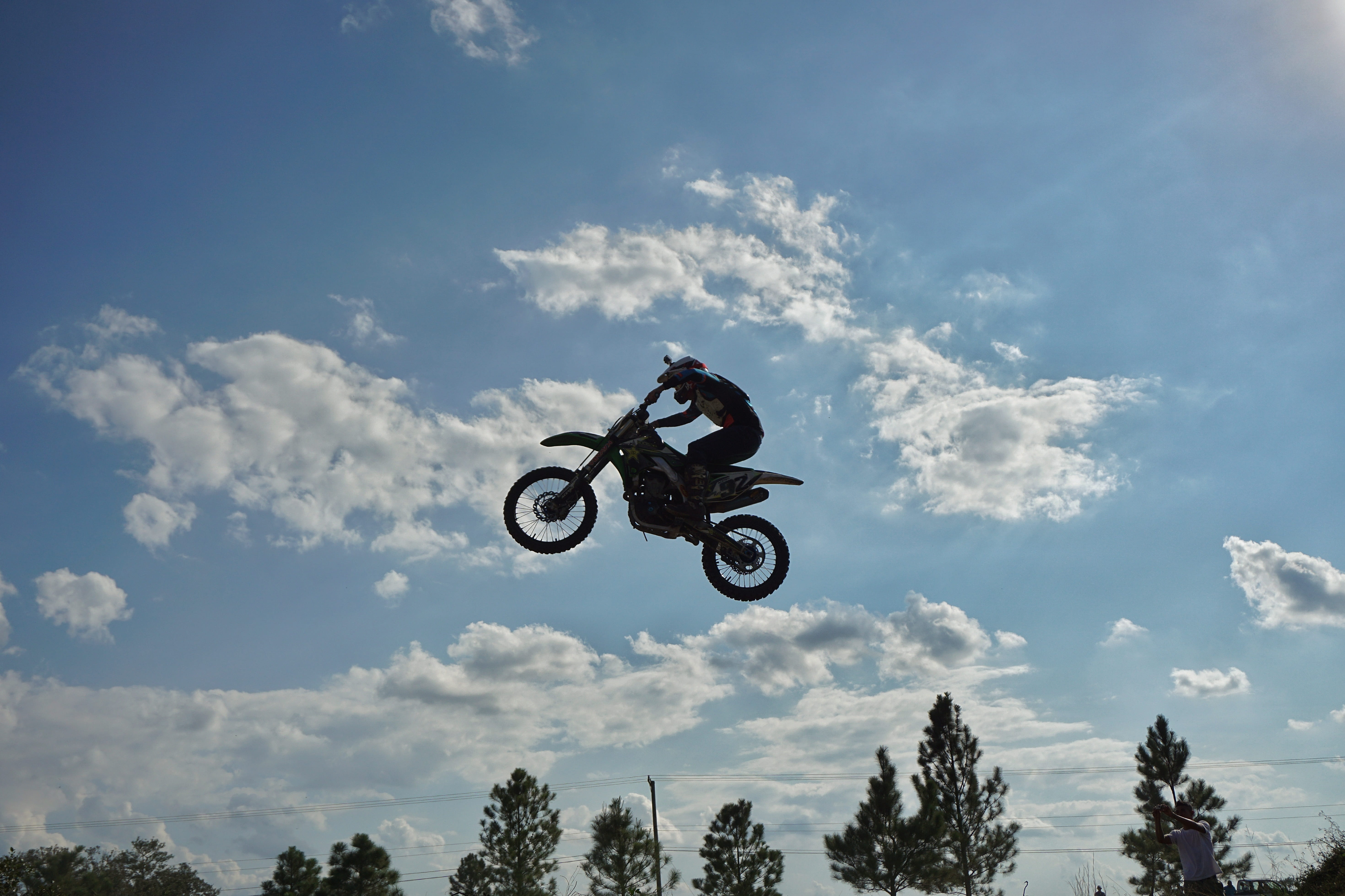 one person, sport, sports helmet, risk, helmet, outdoors, sky, belize, dirt bike, motocross, extreme sports, leisure activity, clouds, stunt, nature, crash helmet, HD Wallpaper