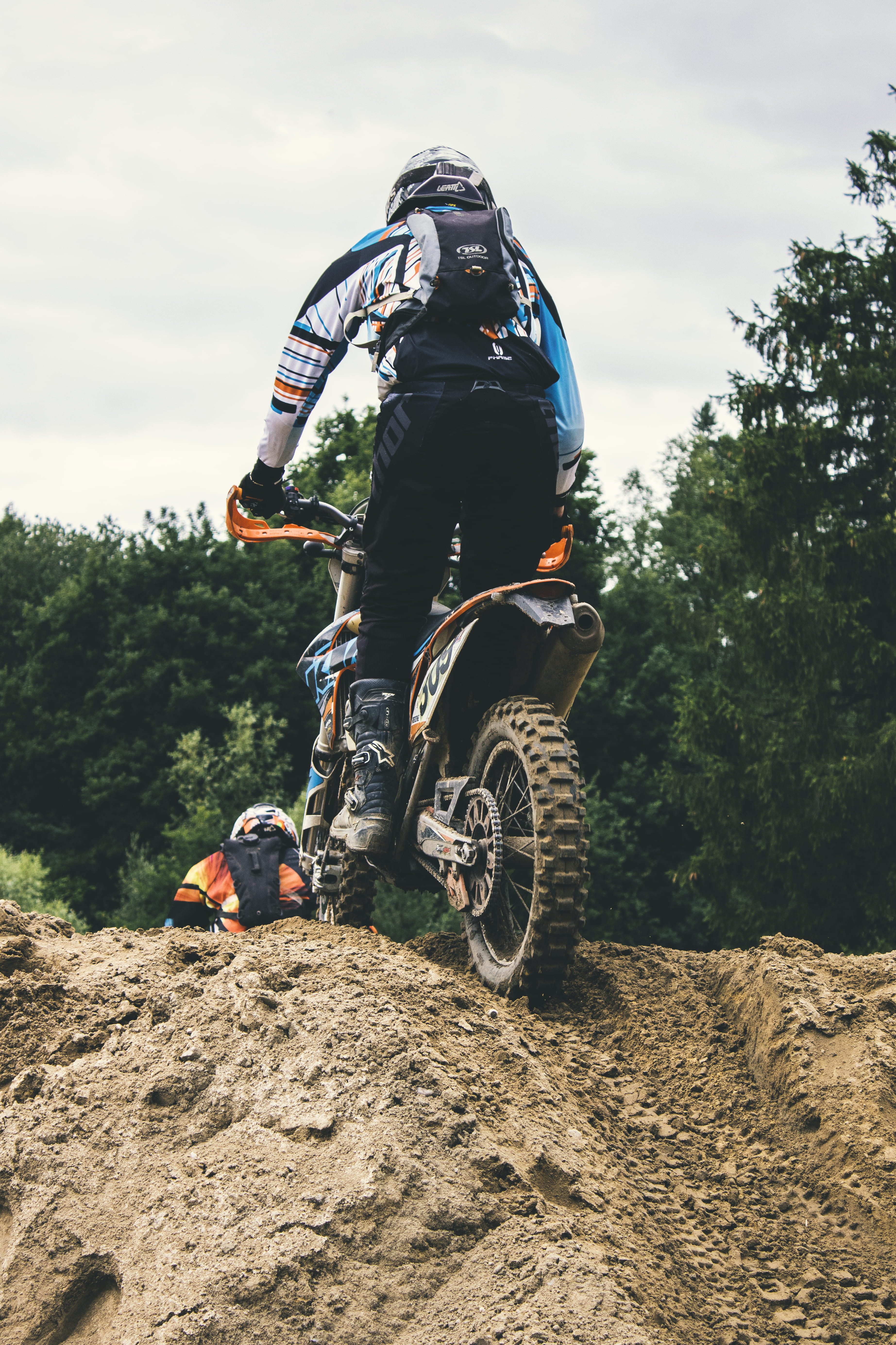 motorcycle, sky, mound, daytime, transportation, motorbike, 5K, real people, ride, men, mode of transportation, motorcross, motocross, crash helmet, person, Phone HD Wallpaper