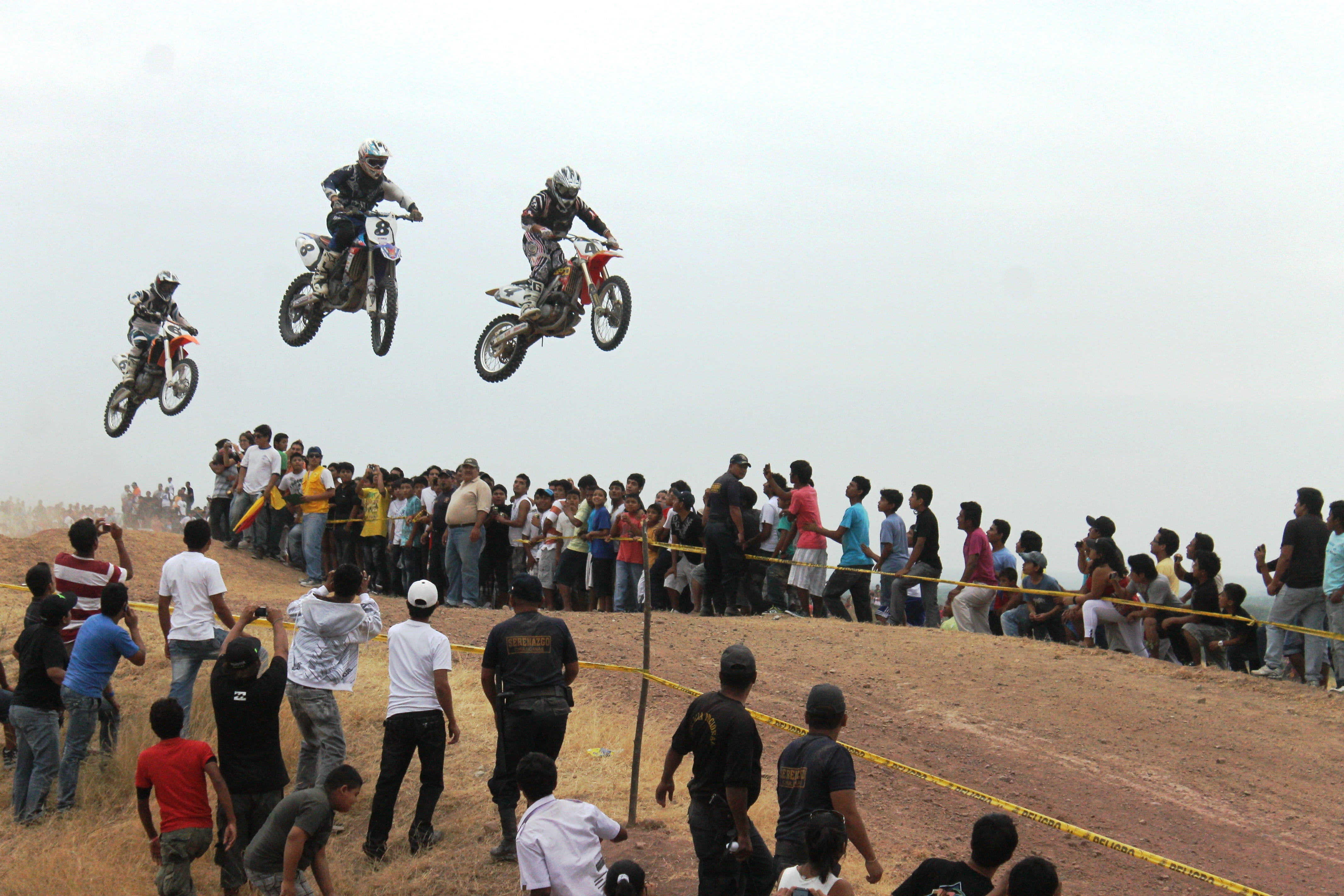 outdoors, real people, three, motion, motorcross, extreme sports, biker, motorbike, riding, crash helmet, sky, motorcycles, race, motocross, spectator, HD Wallpaper