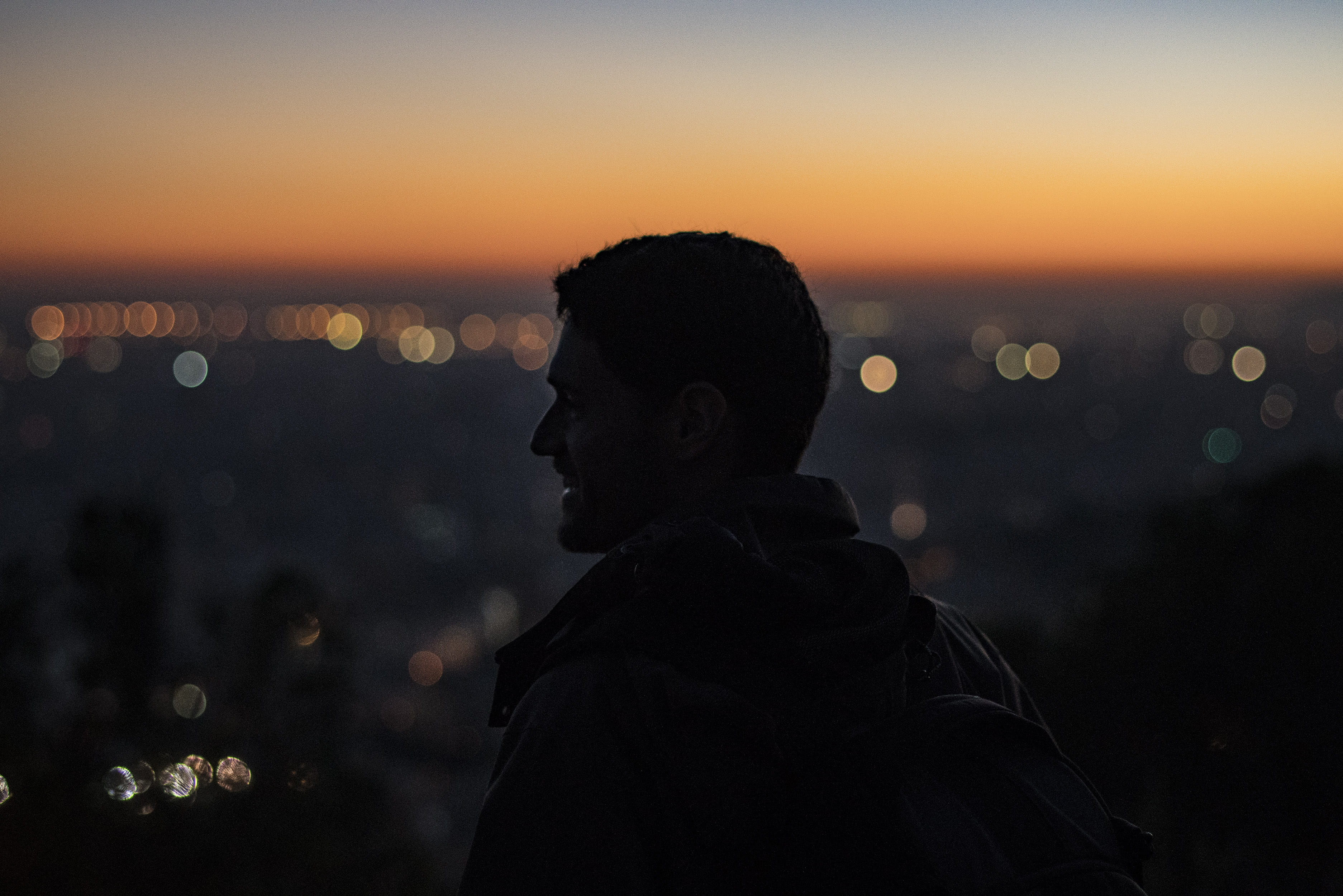 silhouette, person, headshot, adult, nighttime, cityscape, man, dusk, water, beauty in nature, right, lifestyles, orange color, high, leisure activity, HD Wallpaper