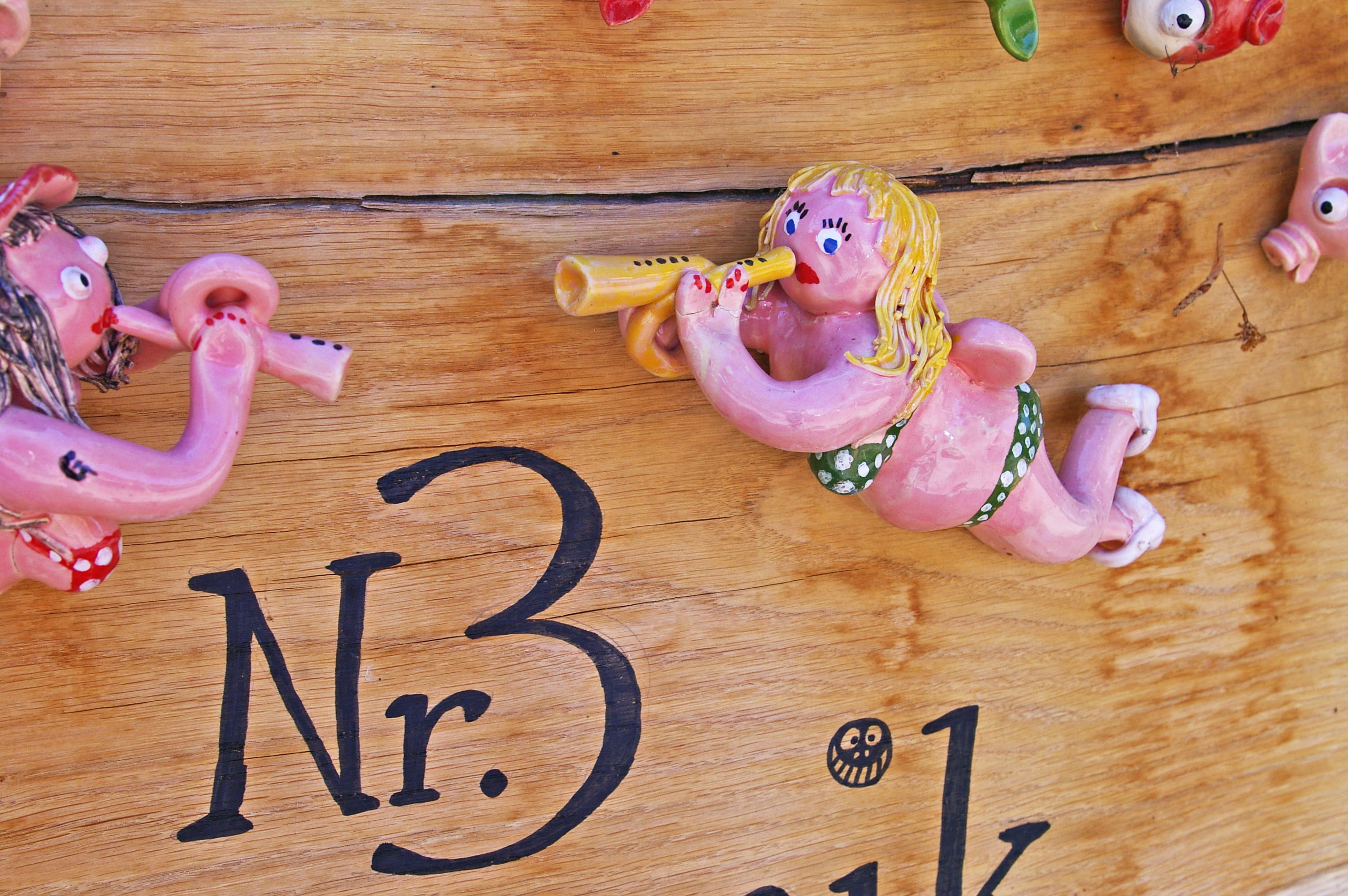 hand labor, funny house number, table, fantasy, hobby, still life, directly above, indoors, pink color, artists, food and drink, decoration, human representation, HD Wallpaper