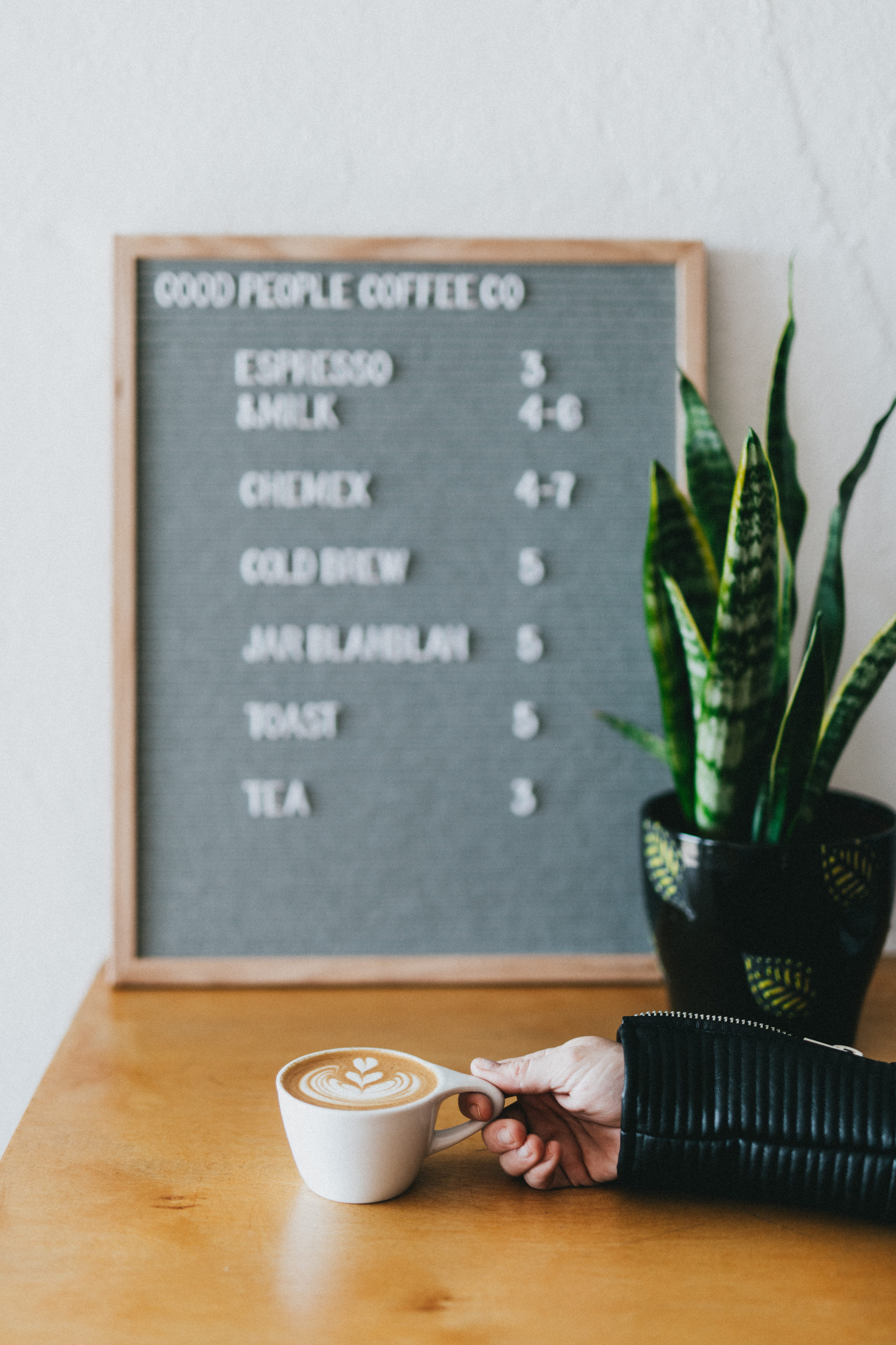 indoors, cafe, person, refreshment, food and drink, 5K, mug, flowering plant, vase, plant, white, cup, board, table, freshness, coffee, text, communication, Phone HD Wallpaper