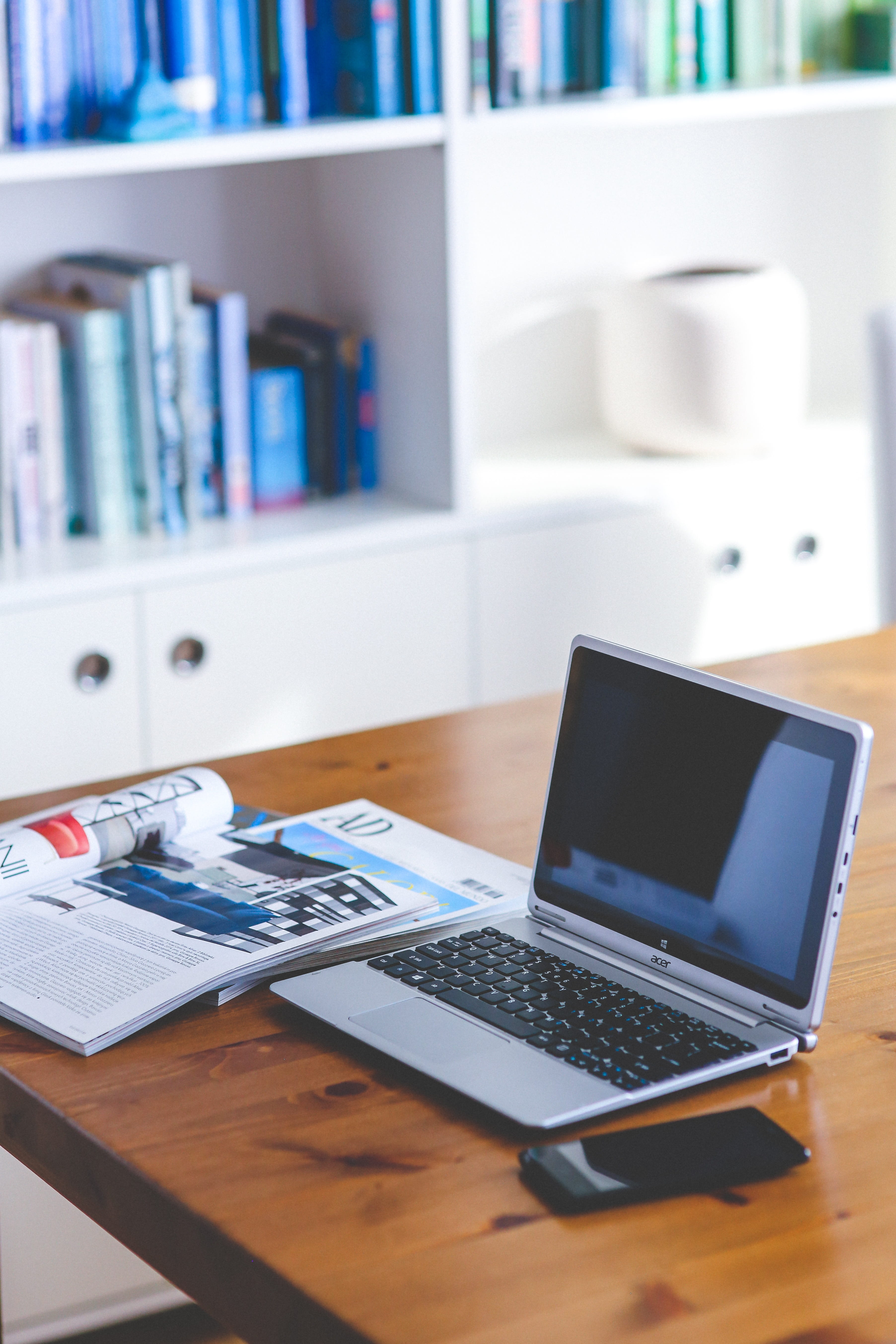 bookshelf, acer, 5K, publication, focus on foreground, smartphone, work, table, computer equipment, computer, indoors, office, furniture, beside, brown, Phone HD Wallpaper