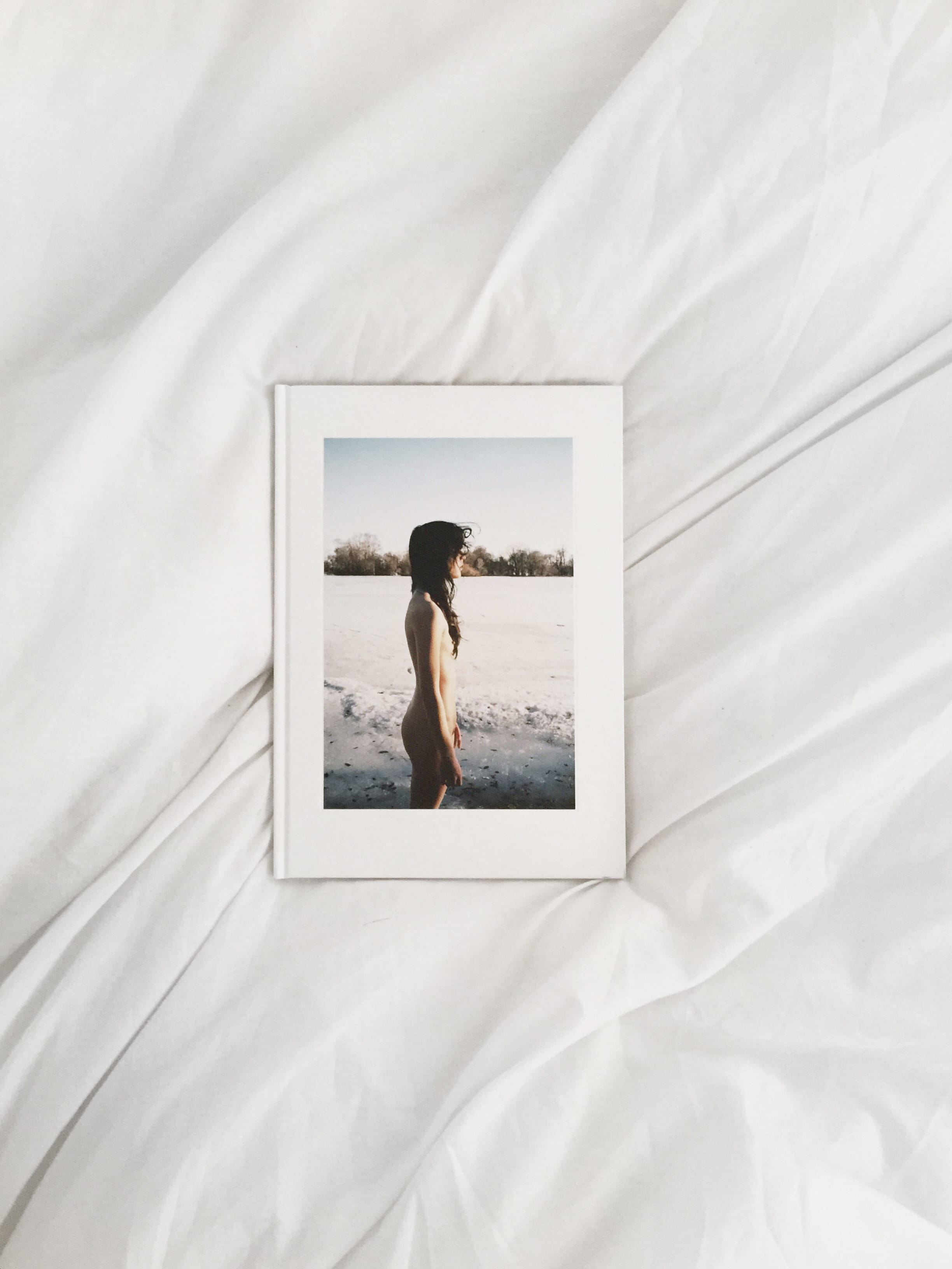 adult, linen, ren hang, young adult, bedroom, book, print, publishing, white color, 2K, sheet, leisure activity, furniture, textile, london, relaxation, Phone HD Wallpaper