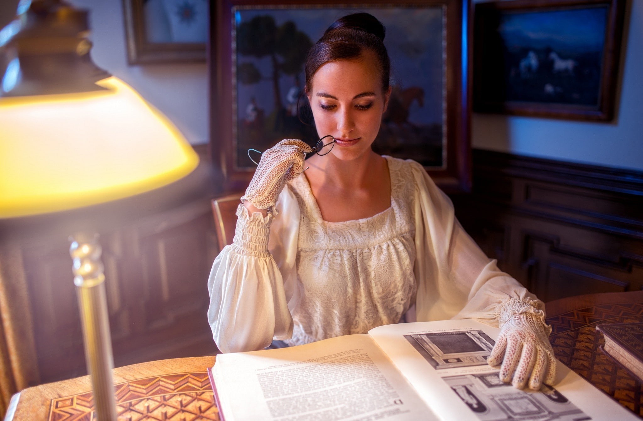 front view, holding, electric lamp, illuminated, young adult, sitting, one person, indoors, women, connection, books, beautiful woman, lighting equipment, HD Wallpaper
