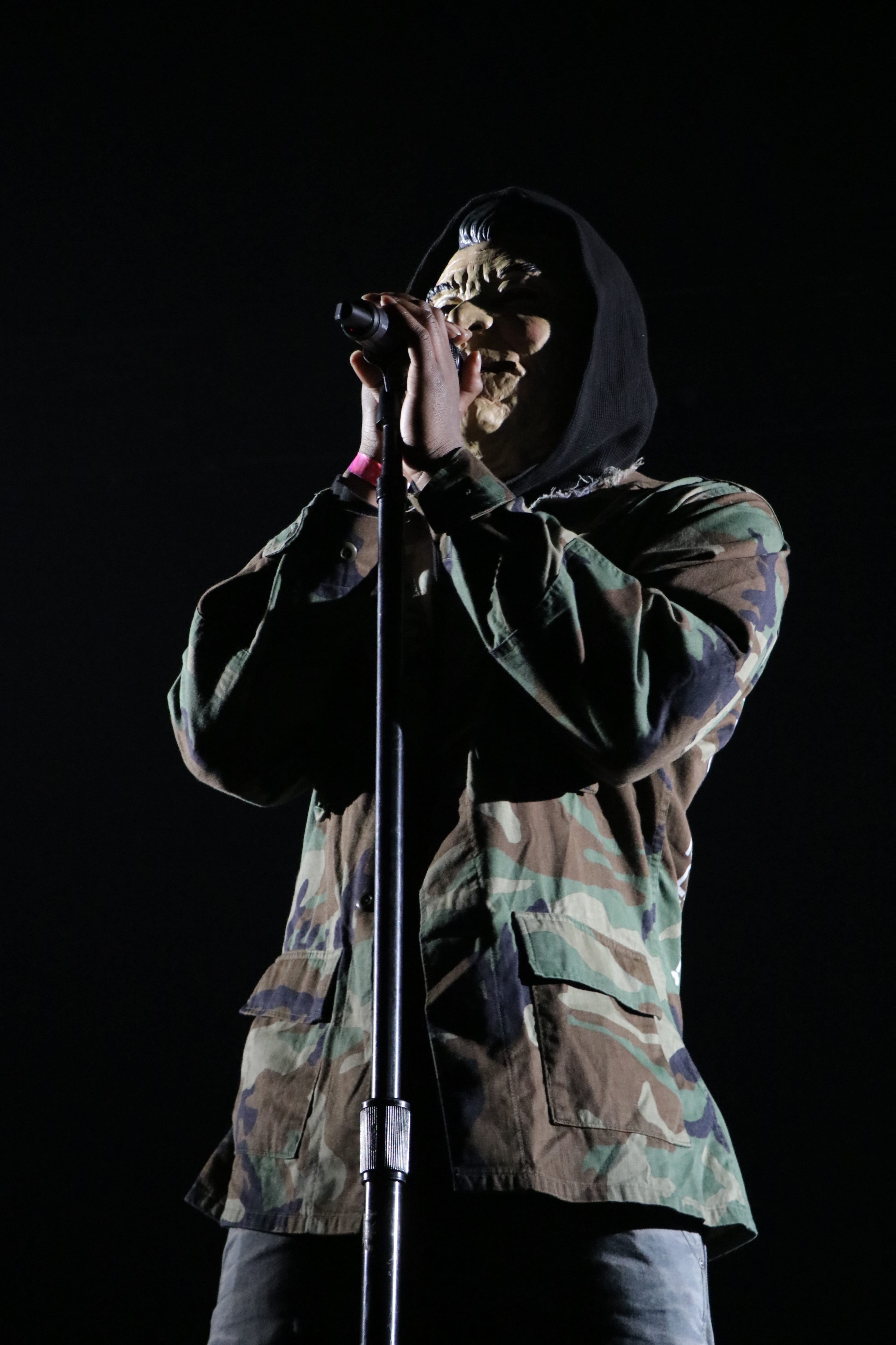 indoors, mic, concert, waist up, spooky, 5K, obscured face, front view, men, war, halloween, evil, standing, hood, unrecognizable person, one person, rapper, Phone HD Wallpaper