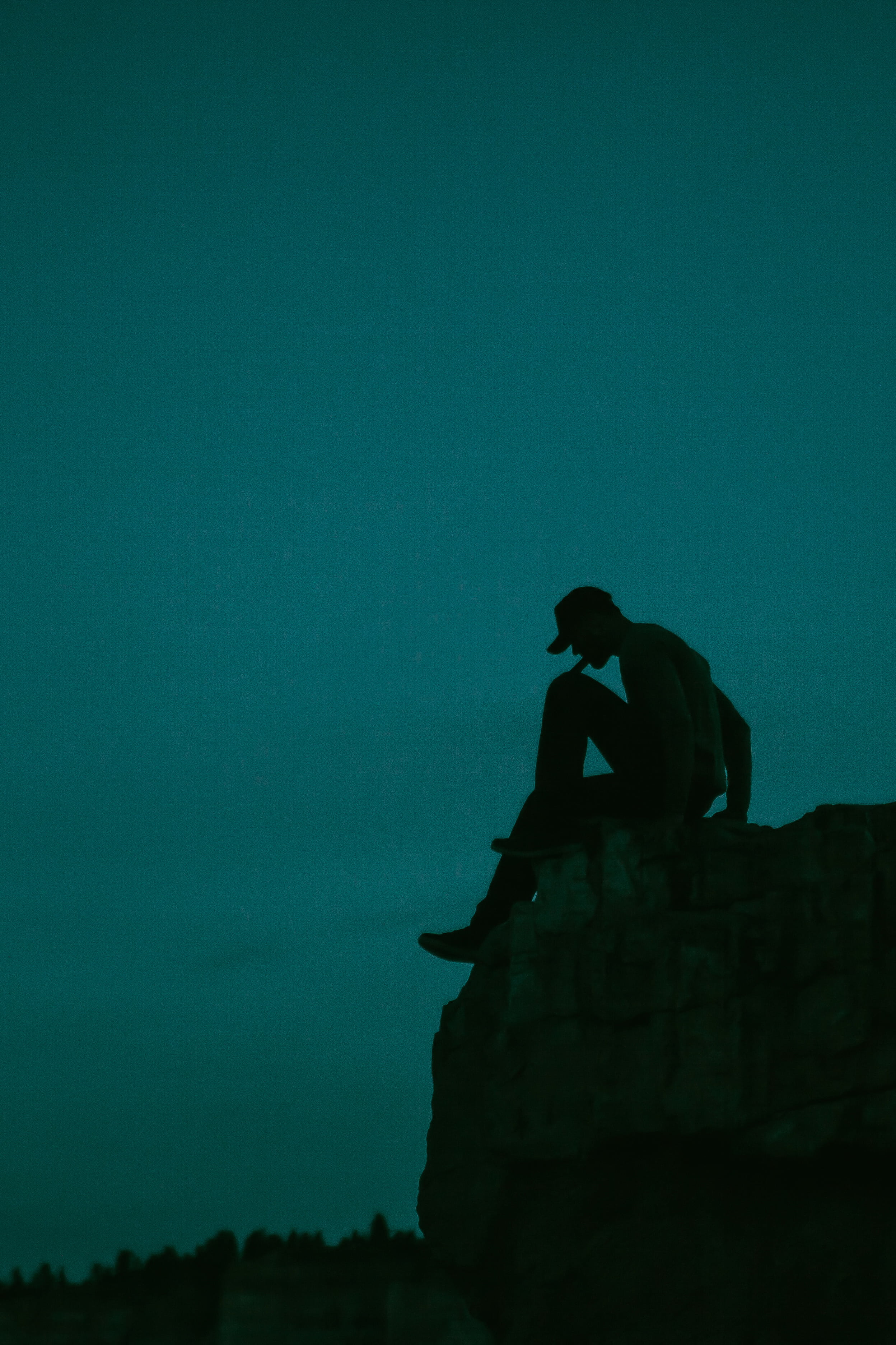 adults only, blue, stone, silhouette, adult, dusk, men, evening, lifestyle, rock, rock - object, leisure activity, 2K, edge, real people, people, one person, Phone HD Wallpaper
