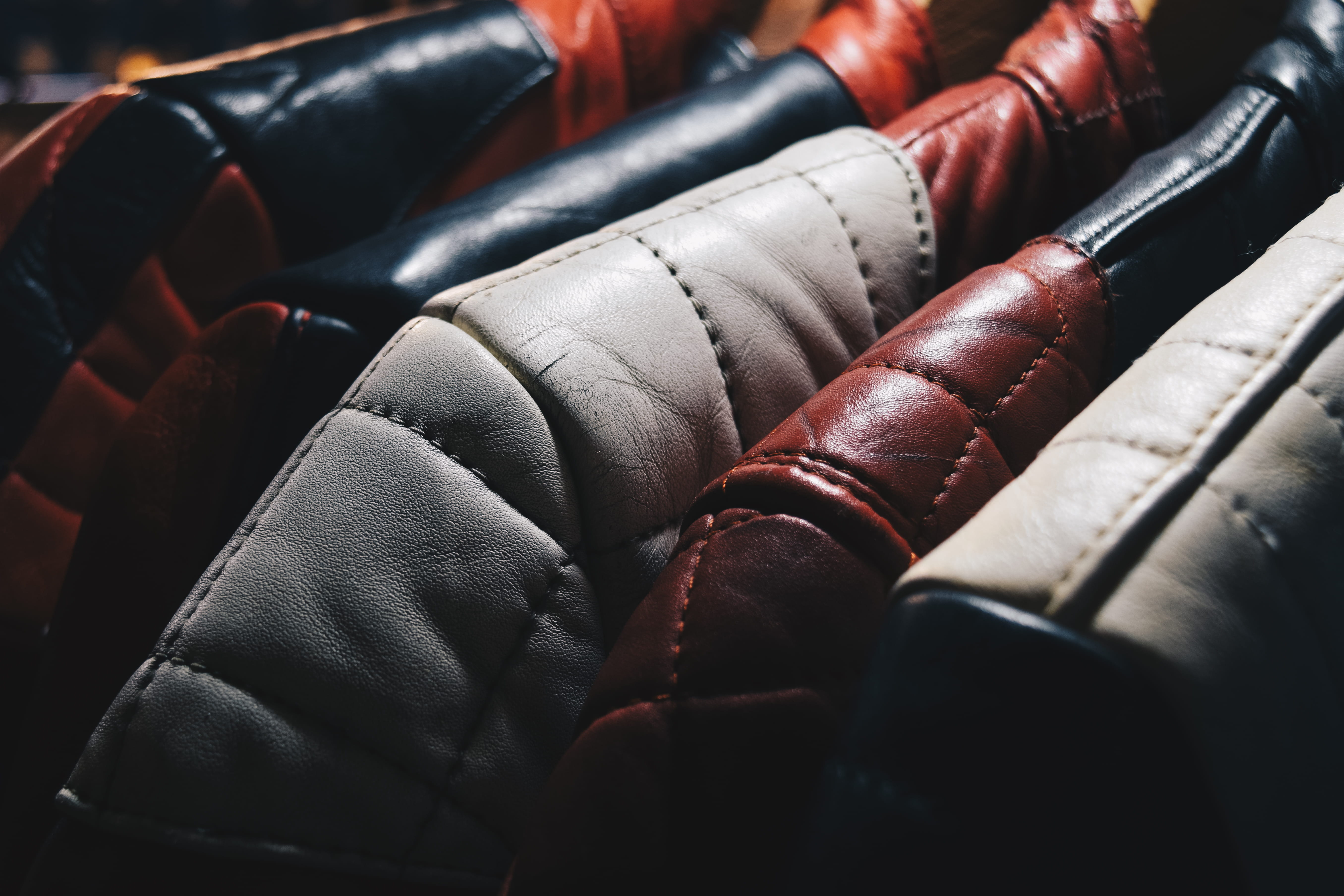 textile, black color, leather jackets, pad, punching, stack, leather, in a row, large group of objects, no People, selective focus, full frame, business, HD Wallpaper