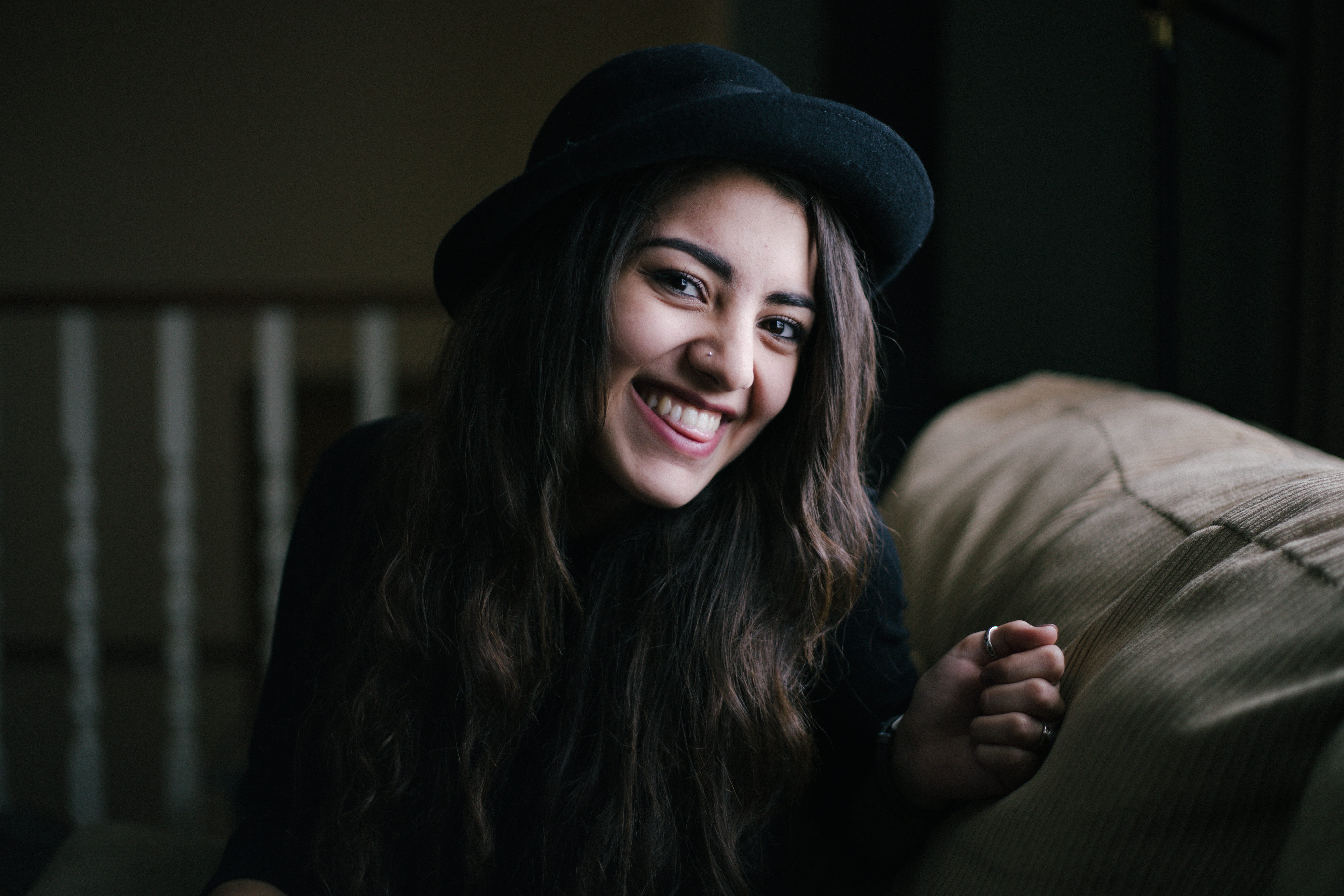 home Interior, sofa, lady, smiling, long Hair, one Person, adult, hairstyle, cheerful, females, female, fedora hat, room, lifestyles, seating, indoors, HD Wallpaper