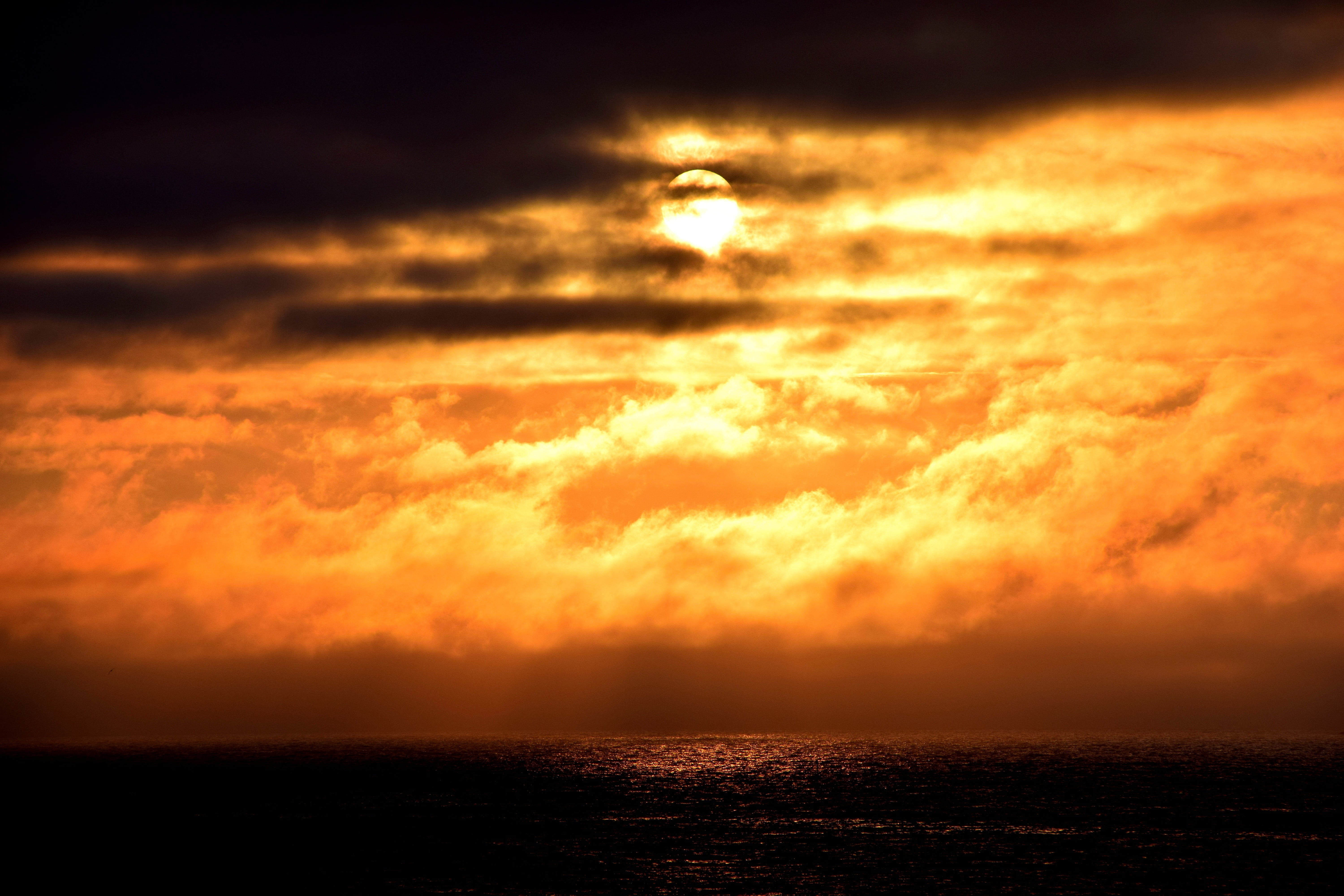 cloud - sky, adventure, beauty in nature, sky, storm, light, environment, rest, 5K, holiday, sunset, water, horizon, relaxation, tranquility, evening sky, HD Wallpaper