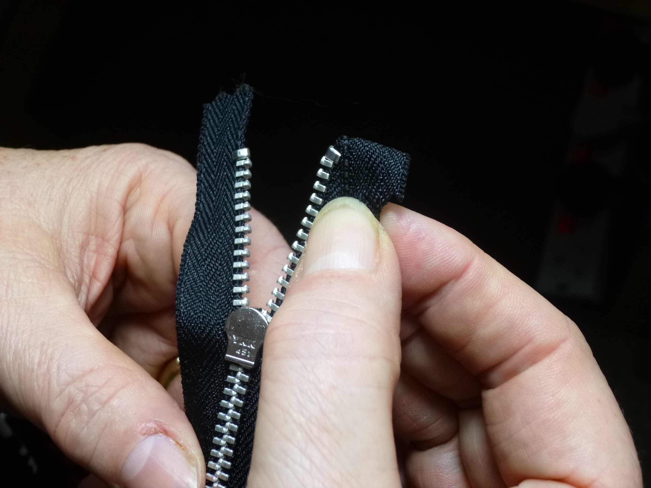finger, body part, tailoring, repair, human body part, zipper, one person, black background, clothing, personal perspective, dressmaking, human finger, HD Wallpaper