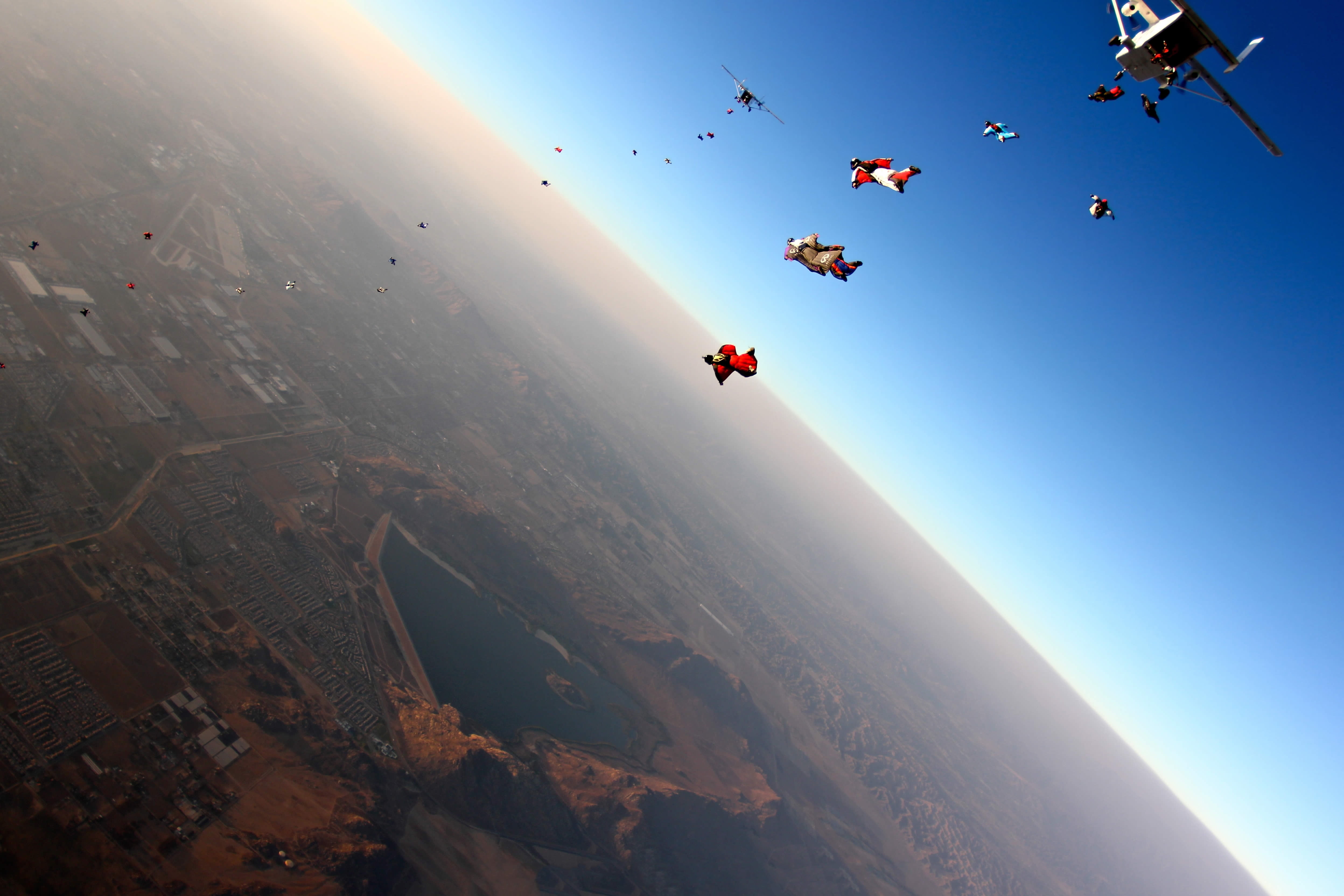 airplane, aerial View, transportation, sunlight, landing - Touching Down, mode of Transport, exhilaration, tranquility, sport, airport, parachute, skydiving, HD Wallpaper