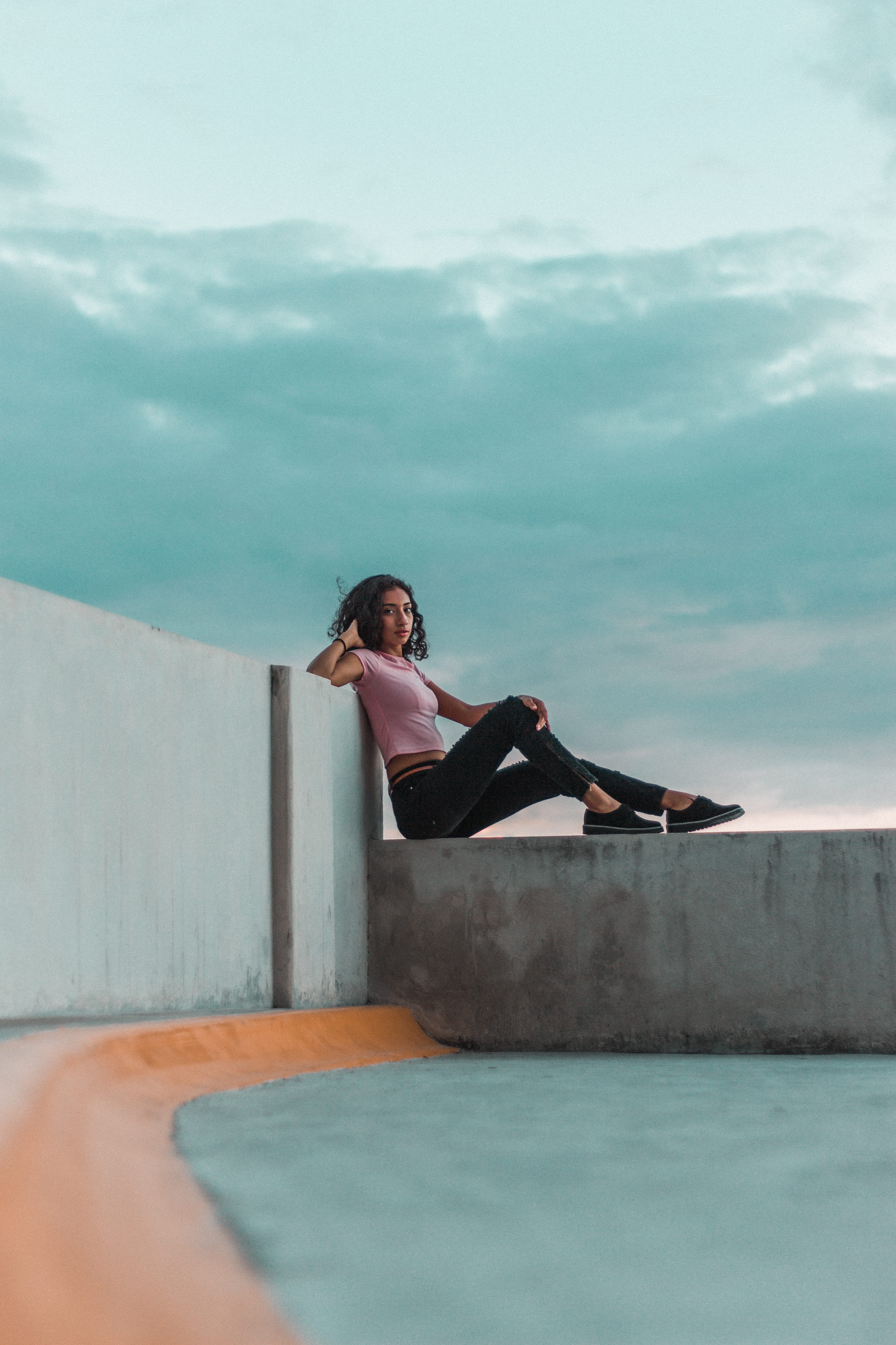 posing, fashion, wear, pants, sneakers, relaxation, t, t-shirt, model, wearing, hairstyle, female, posture, leisure activity, wall - building feature, young adult, Phone HD Wallpaper