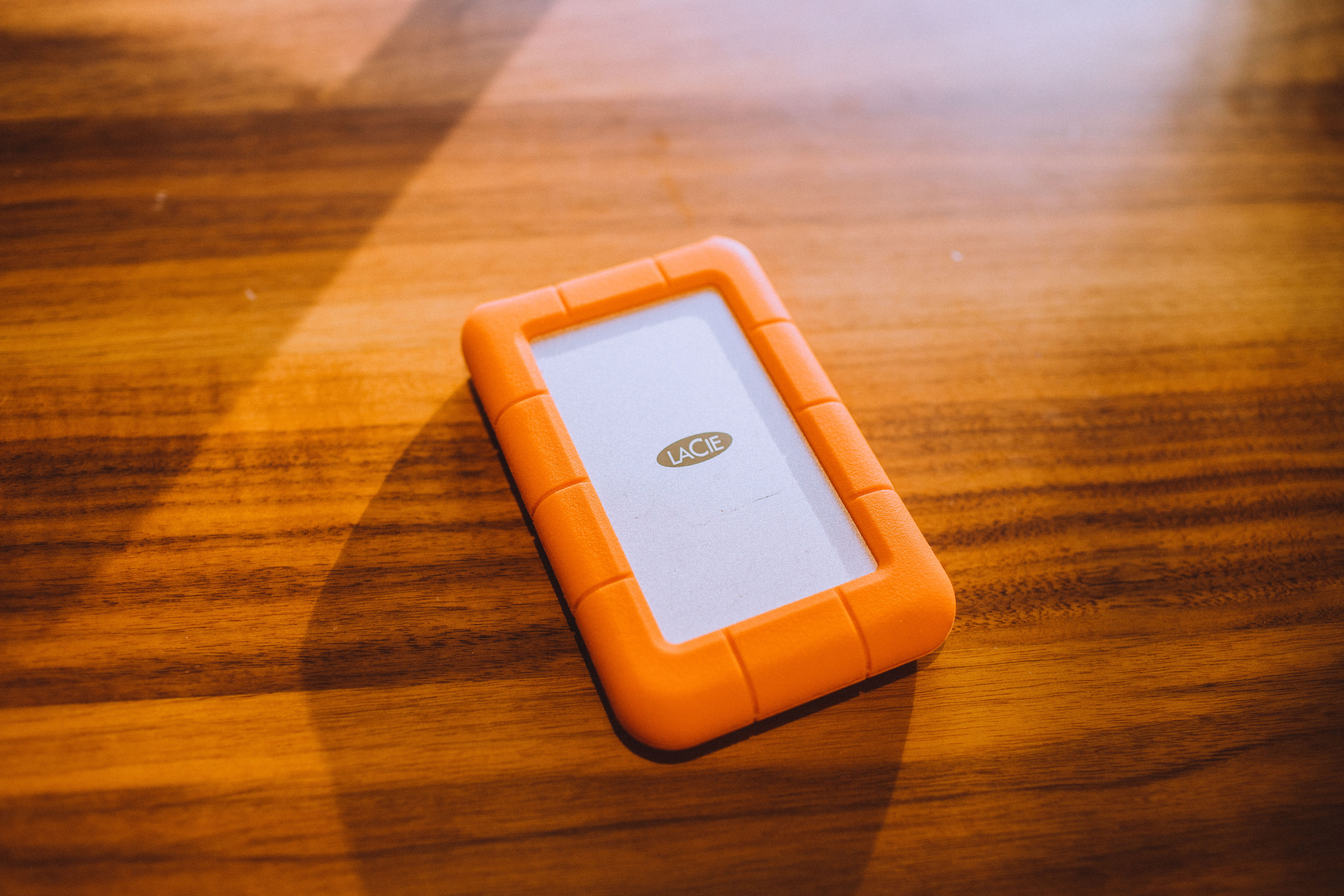 communication, single object, case, smartphone, table, high angle view, wood, smart phone, rubberize, technology, portable information device, orange, wood grain, HD Wallpaper