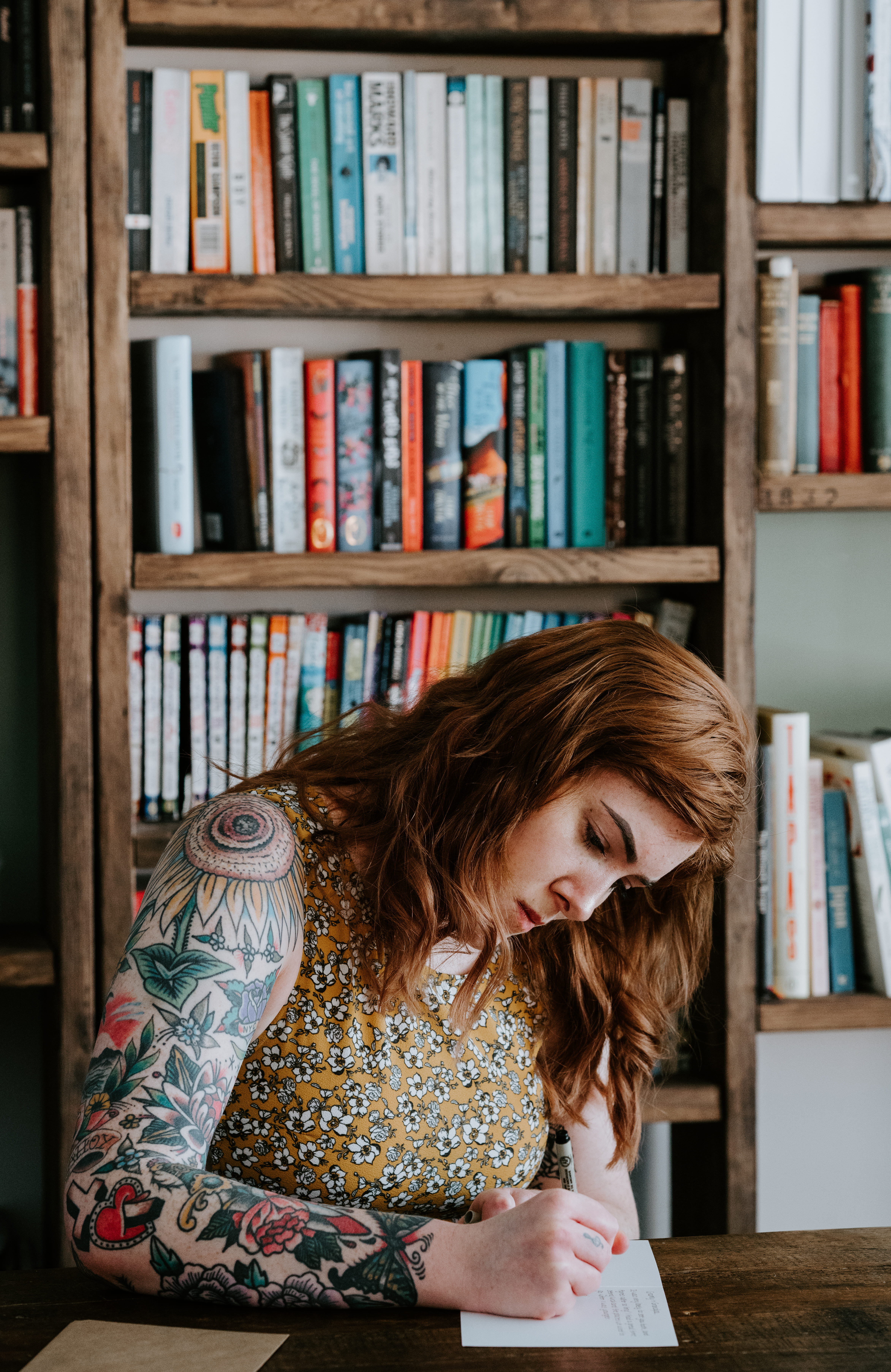 red, bookcase, young adult, bookcases, adult, redhead, flower, girl, lady, green, one person, writing, floral pattern, publication, paper, female, 5K, Phone HD Wallpaper