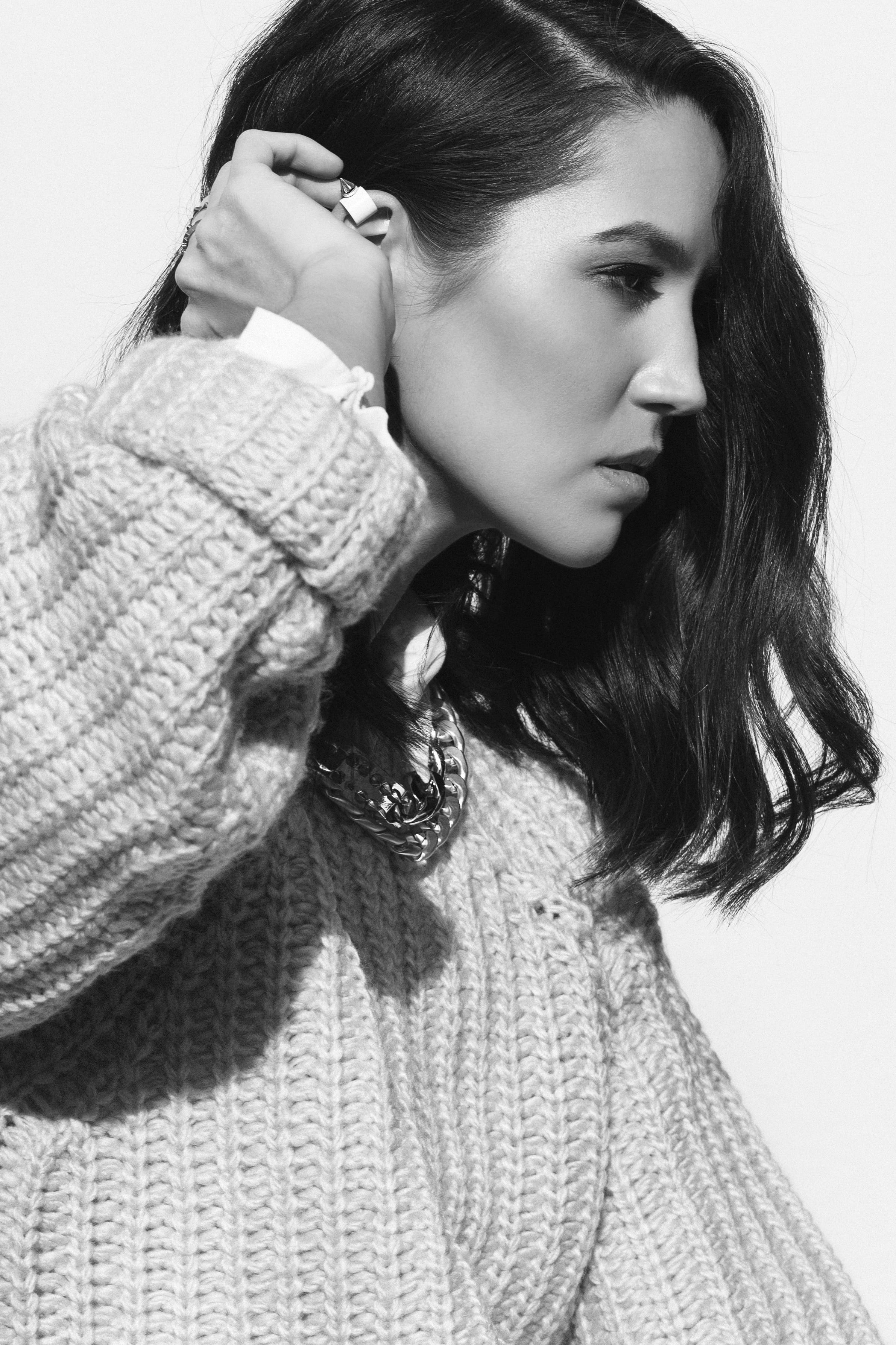 women, contemplation, child, unique, headshot, hairstyle, business, grayscale, indoors, holding, face, apparel, young women, sweater, casual clothing, female, Phone HD Wallpaper