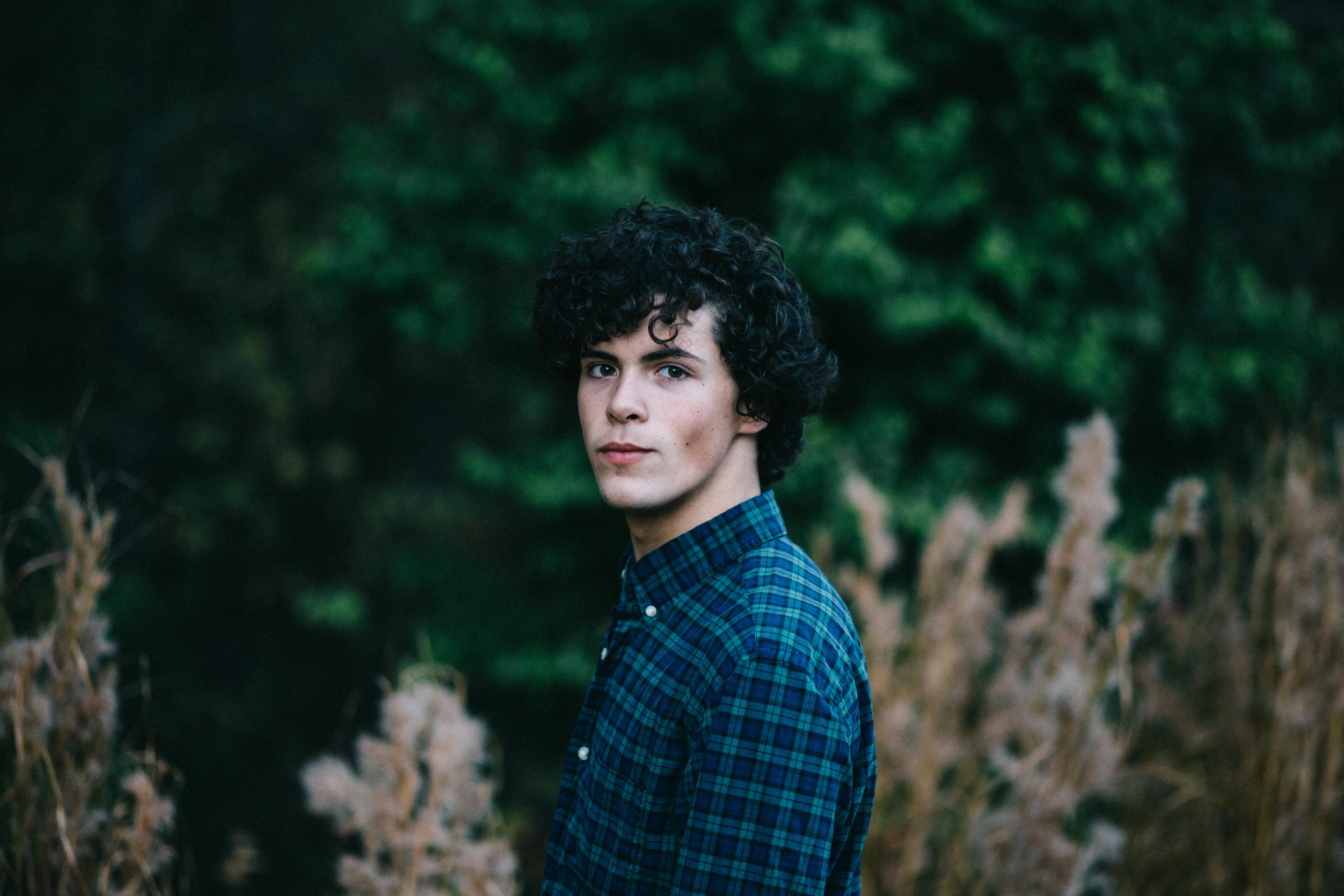 tree, contemplation, land, standing, young Adult, men, forest, 4K, adults only, shirt, hairstyle, one Person, serious, looking At Camera, Man, wearing, HD Wallpaper