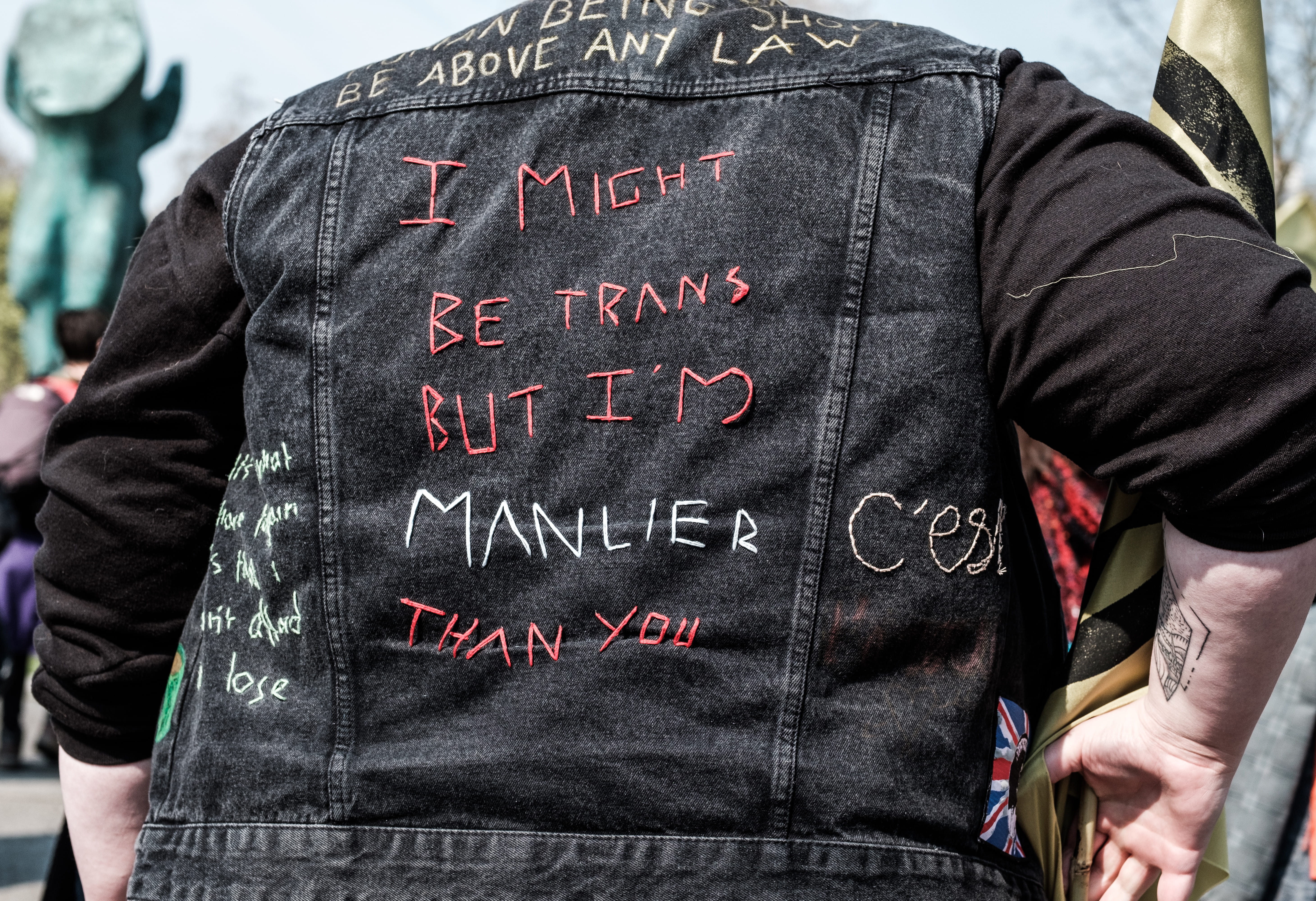 stained glass, rear view, text, lifejacket, coat, vest, jacket, scarf, real people, holding, pants, street demonstration protest candid fuji fujifilm, outdoors, HD Wallpaper